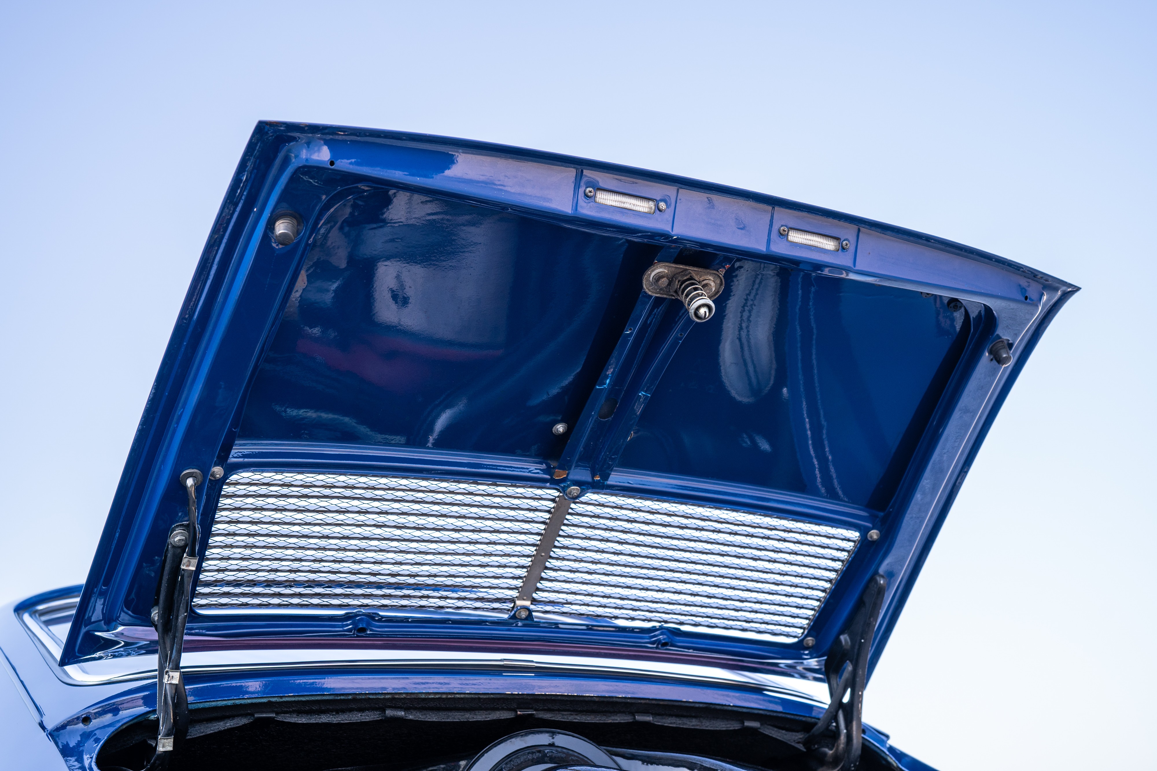 Trunk lid on a 1969 Porsche 911S in Ossi Blue over Red.