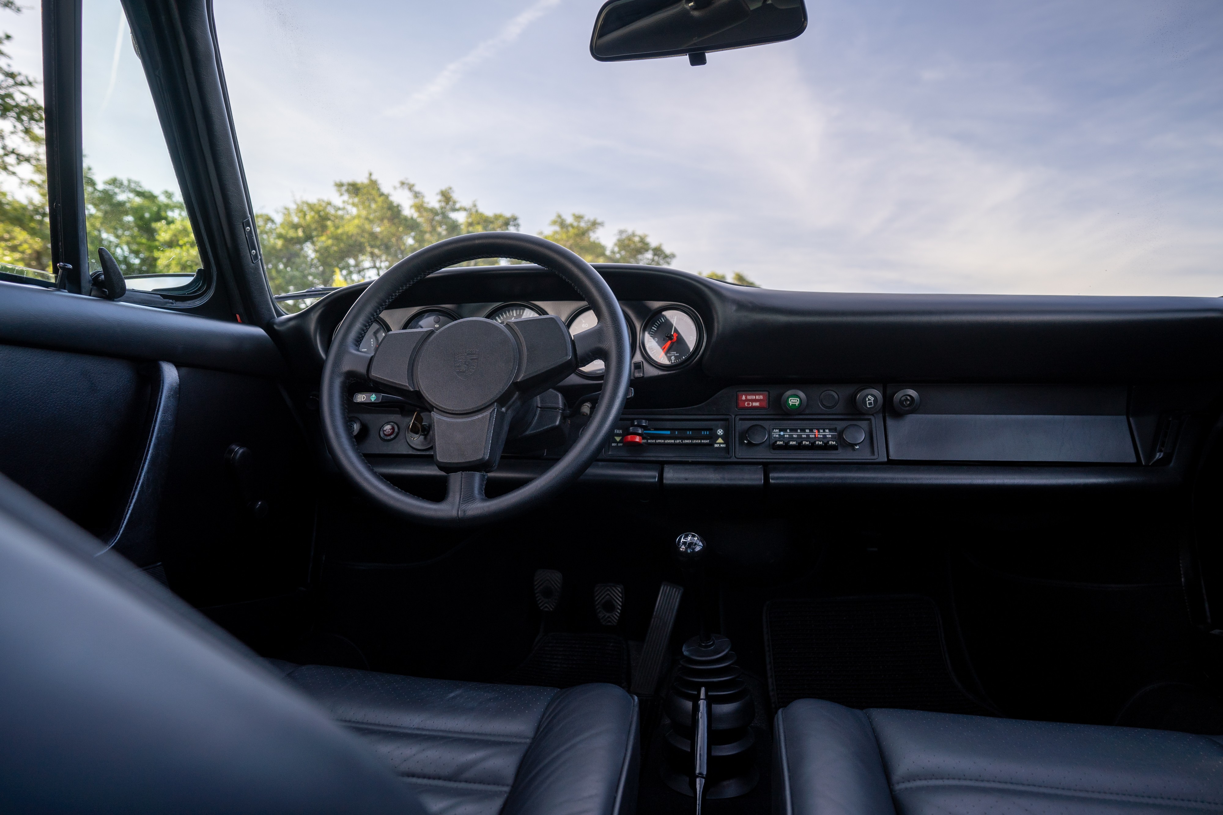 Interior of a 1974 Porsche 911 Carrera Targa in Peru Red over Black.