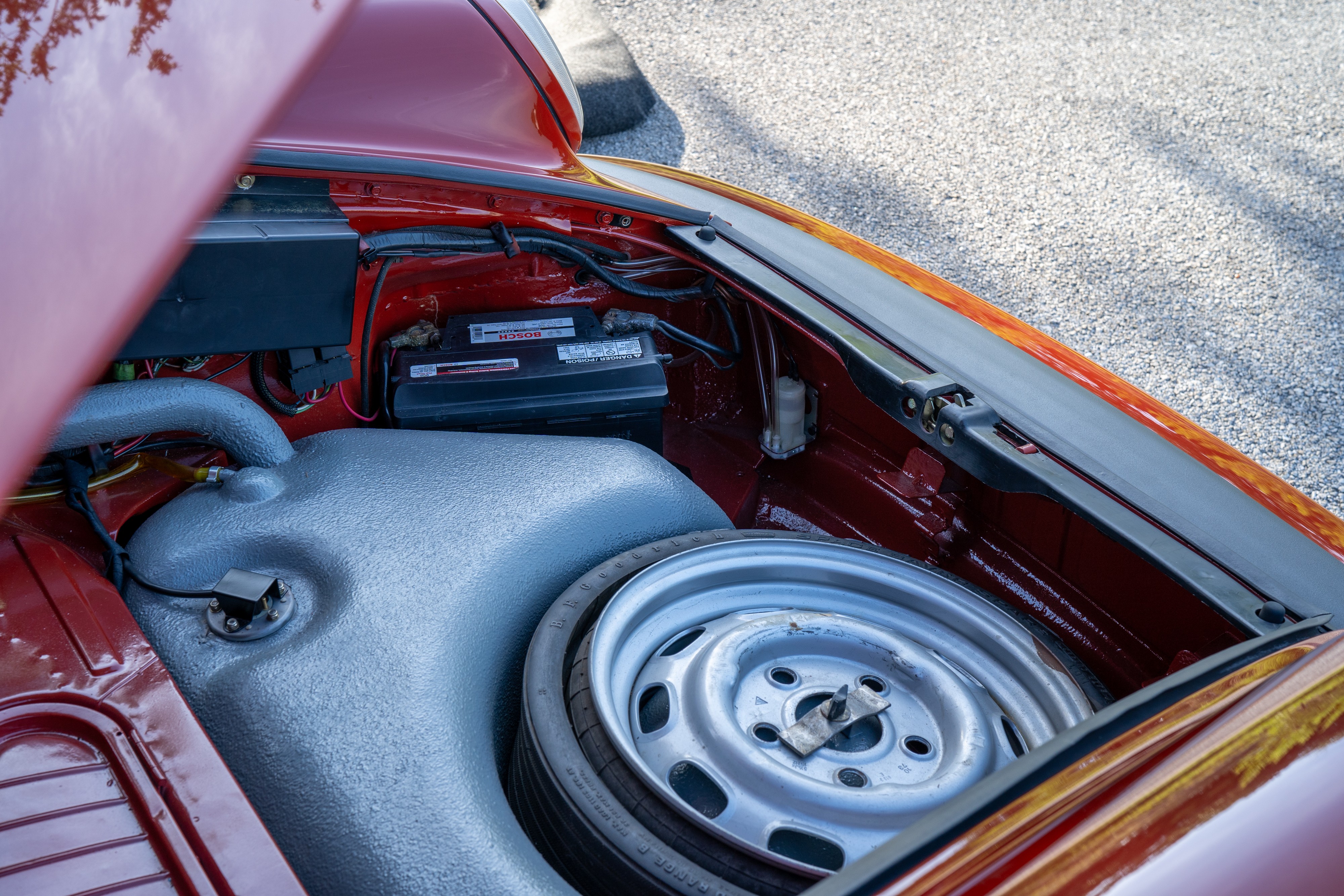 Frunk on a 1974 Porsche 911 Carrera Targa in Peru Red over Black.