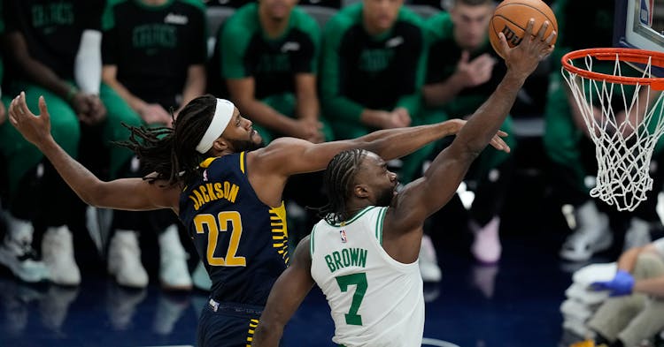 Jaylen Brown scoring a layup.