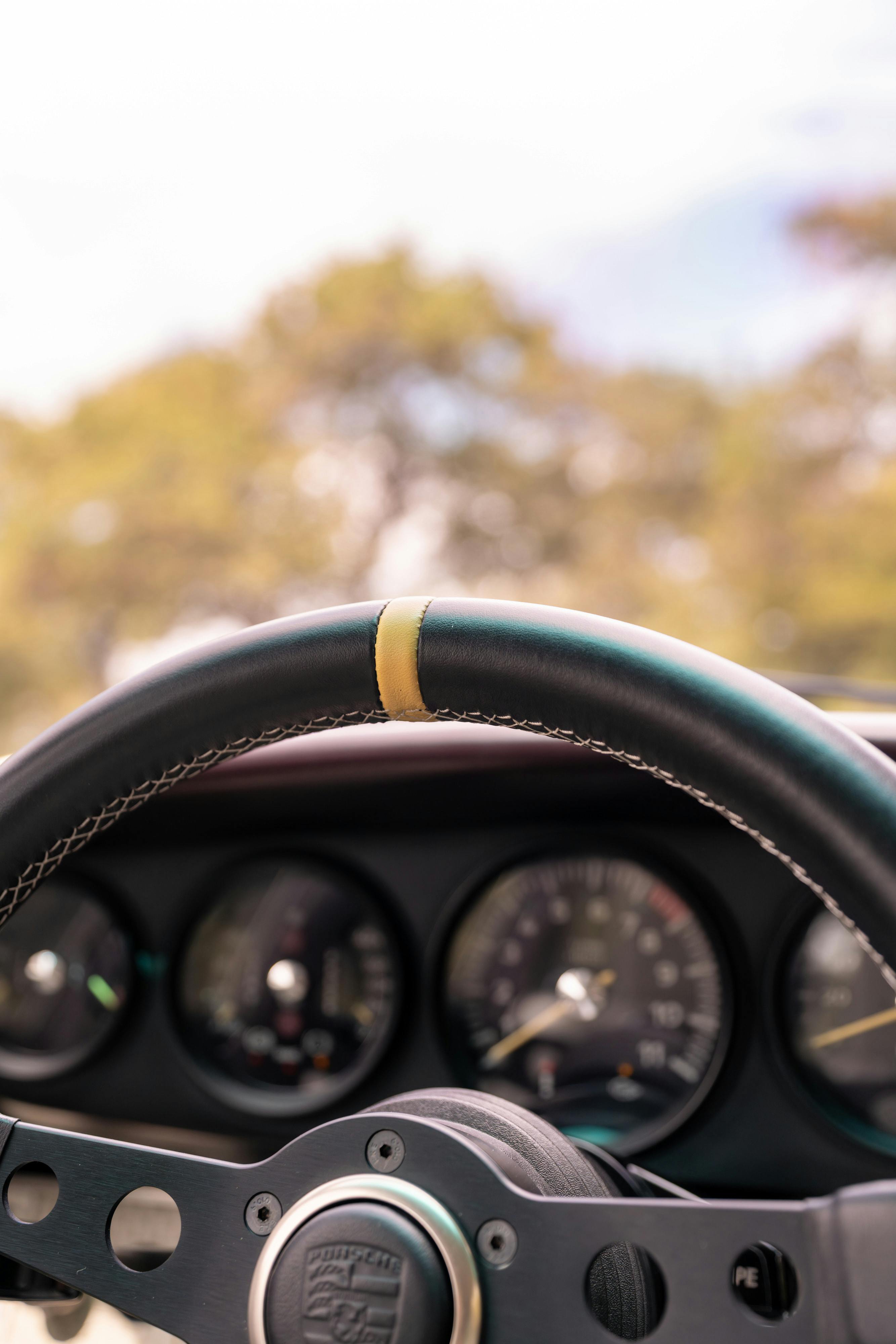 1990 Singer Porsche 911 Carrera 2 "Austin" commission in Aubergine Metallic shot in Austin, TX for a Bring a Trailer auction.