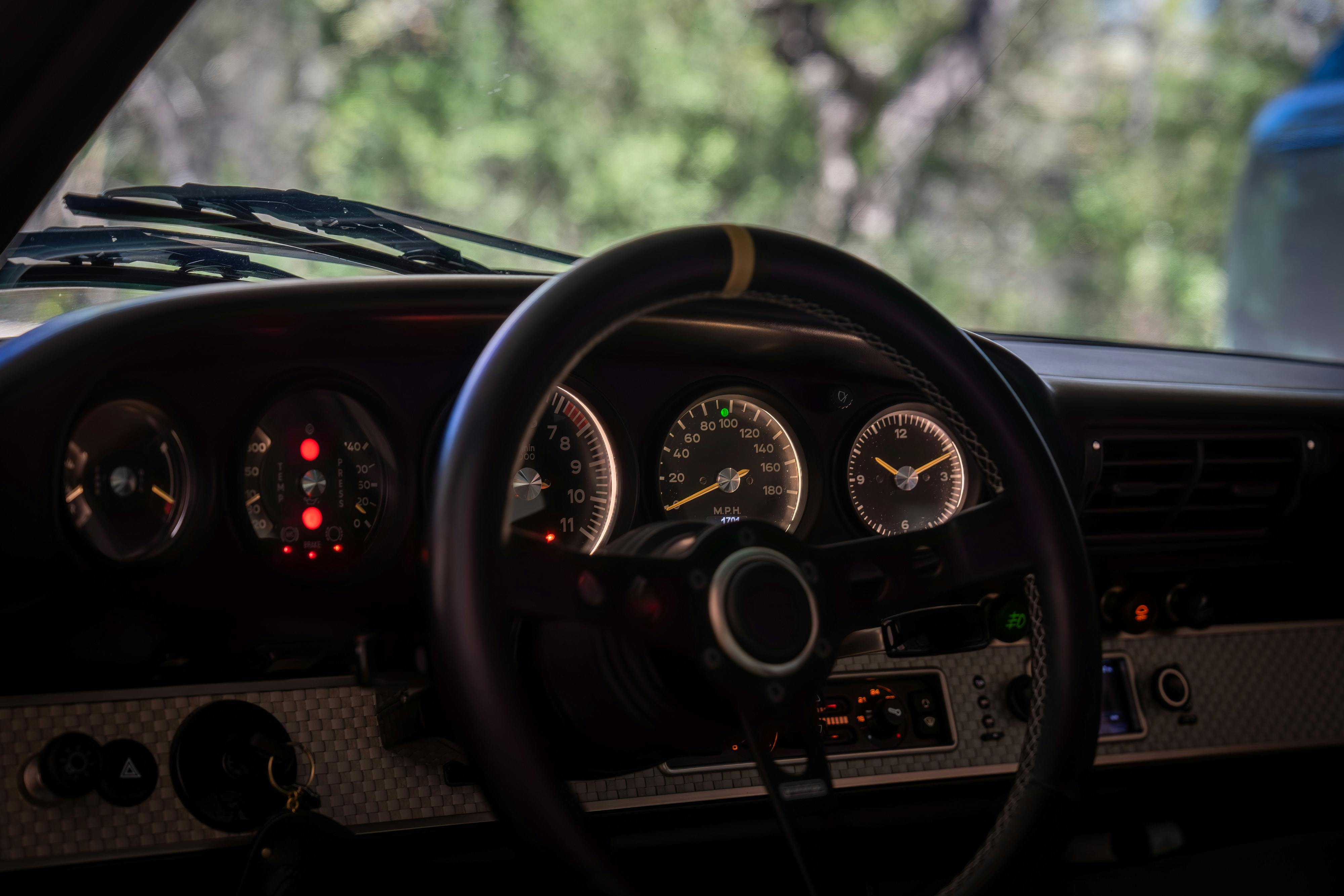 1990 Singer Porsche 911 Carrera 2 "Austin" commission in Aubergine Metallic shot in Austin, TX for a Bring a Trailer auction.