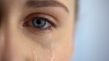 woman crying single eye with tears