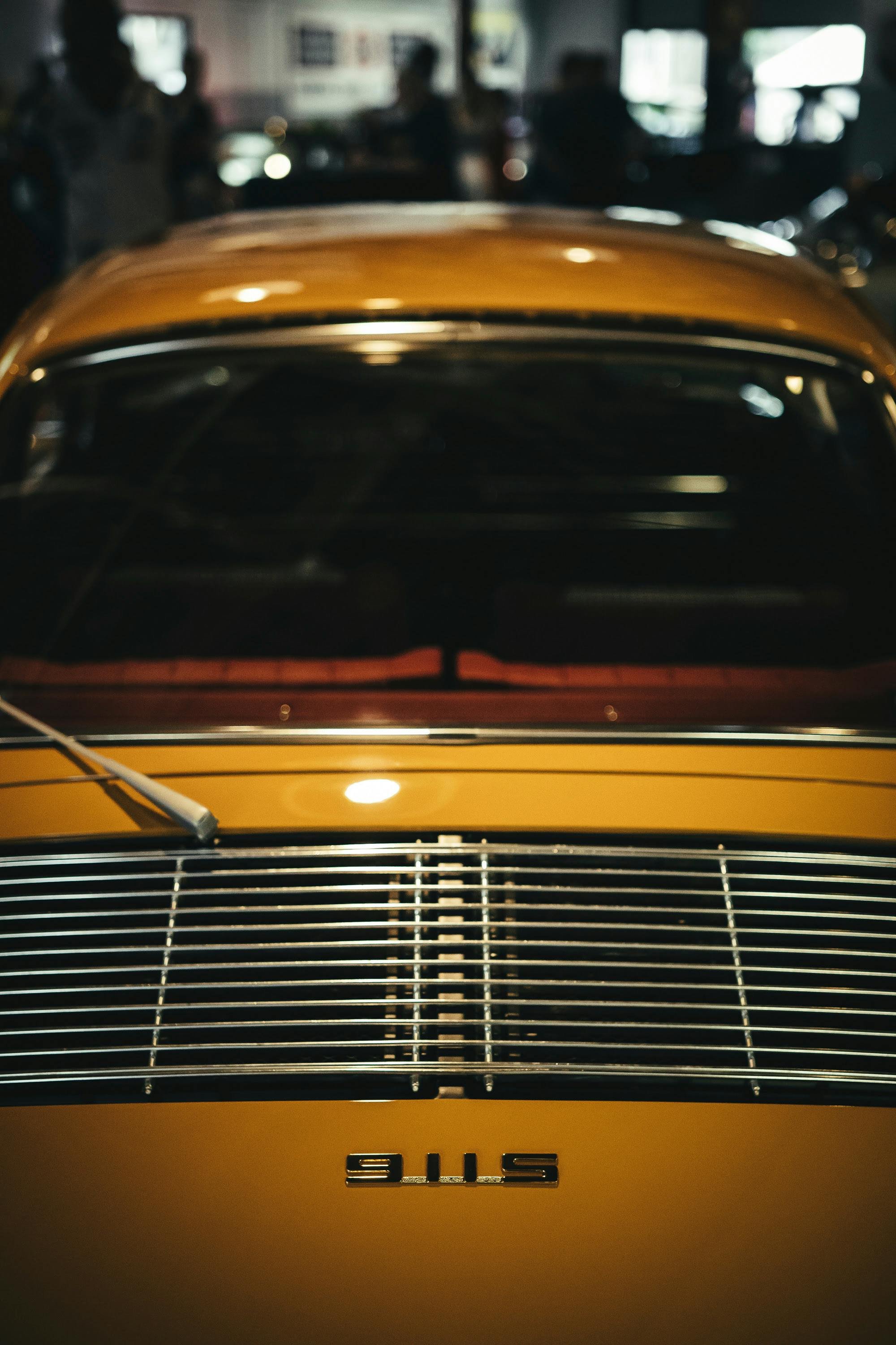 Yellow 911S with red Houndstooth interior.
