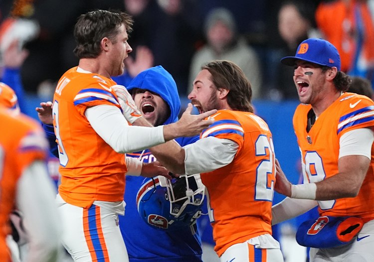 Broncos kicker Wil Lutz celebrates with cornerback Riley Moss after his game-winning field goal against the Seahawks.