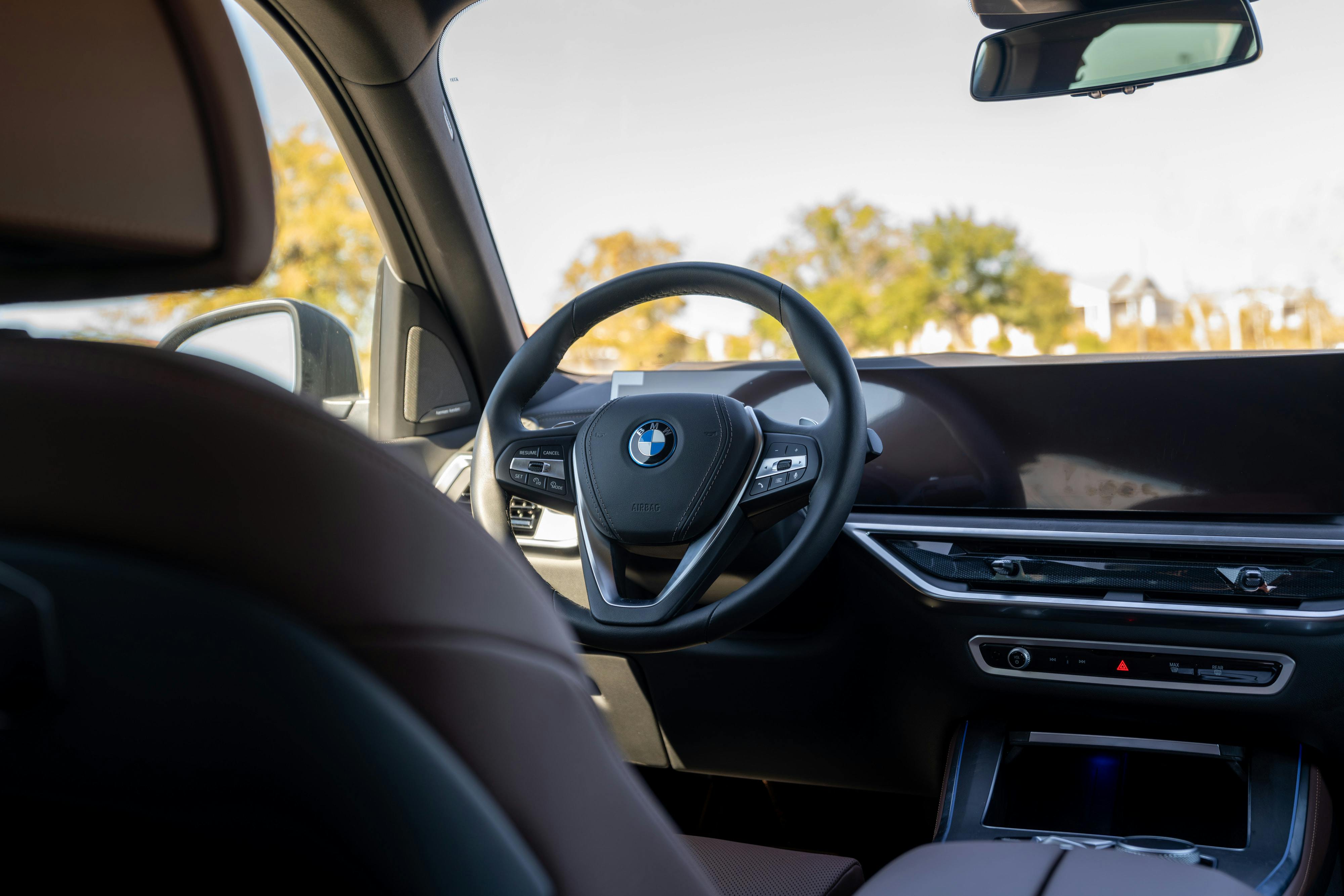 2026 BMW X5 in Manhattan Green Metallic shot in Austin, TX for a Turo rental.