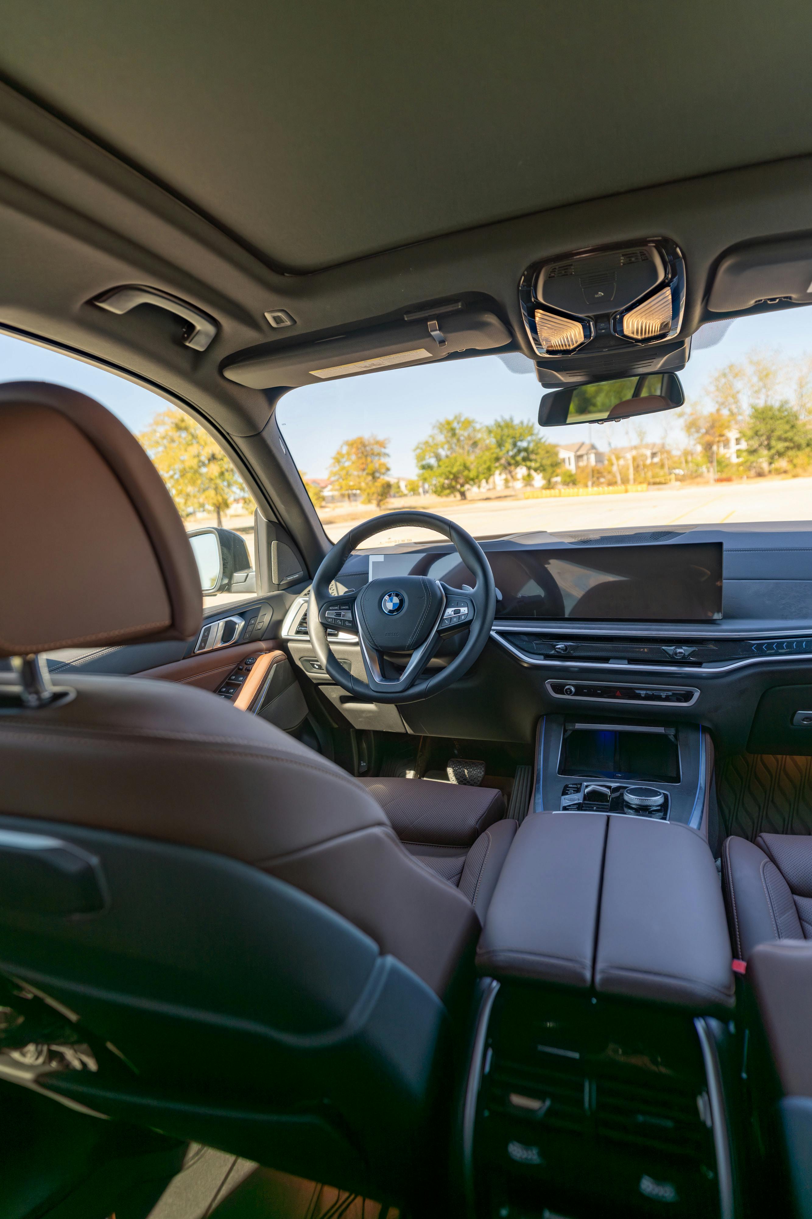 2026 BMW X5 in Manhattan Green Metallic shot in Austin, TX for a Turo rental.