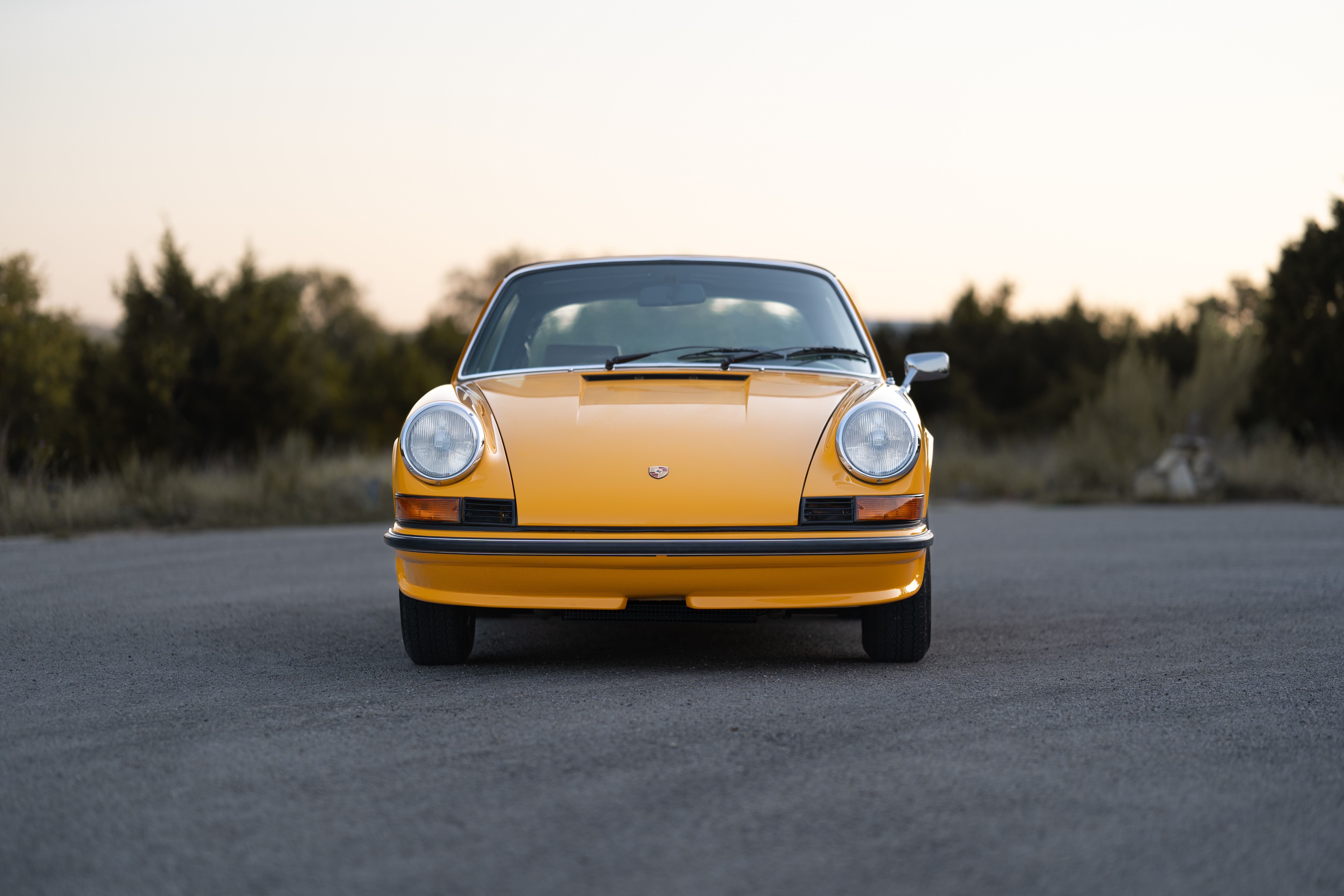 A Signal Yellow 1973 Porsche 911S Targa with brown interior in Austin, TX.