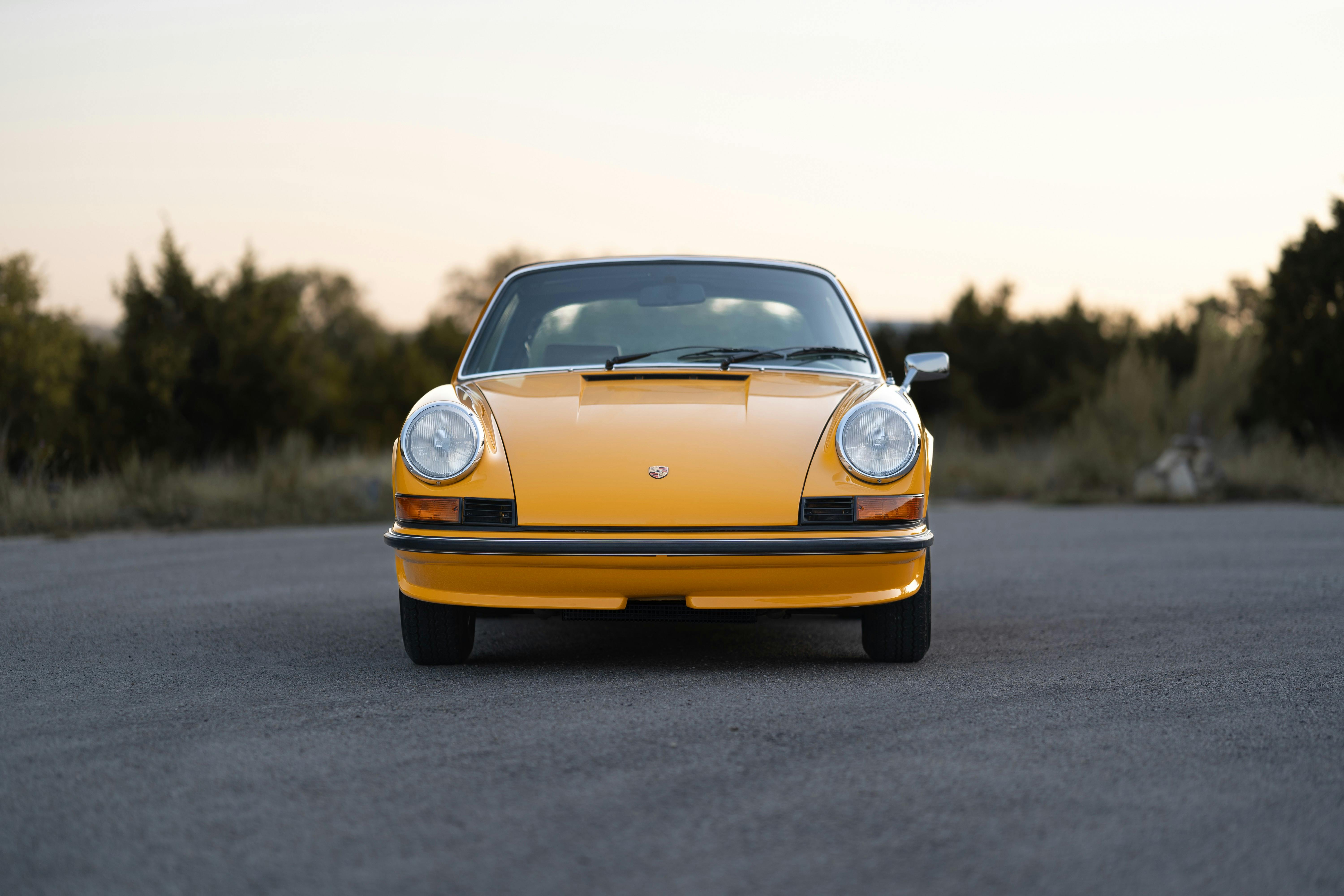 A Signal Yellow 1973 Porsche 911S Targa with brown interior in Austin, TX.