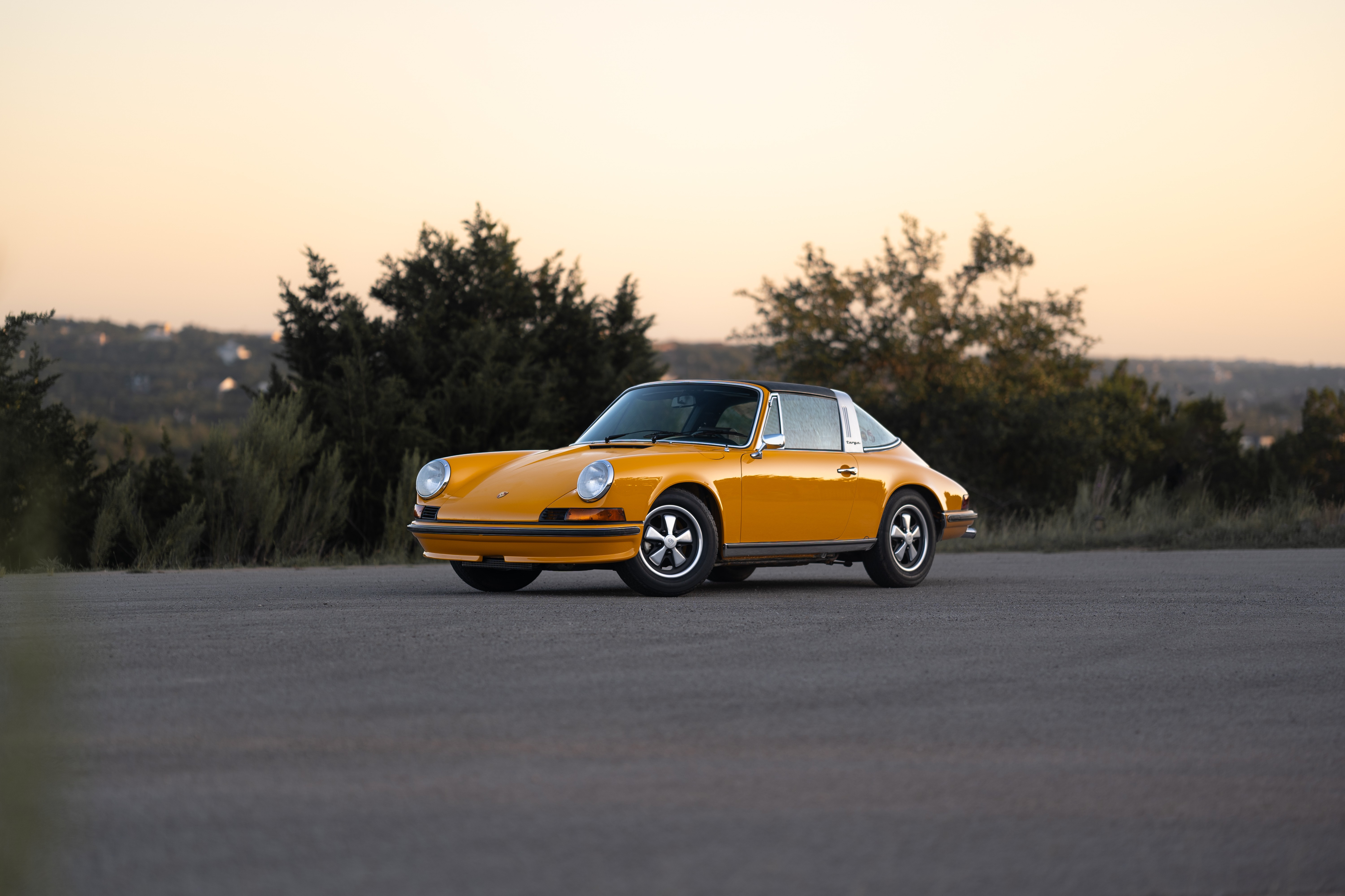 A Signal Yellow 1973 Porsche 911S Targa with brown interior in Austin, TX.