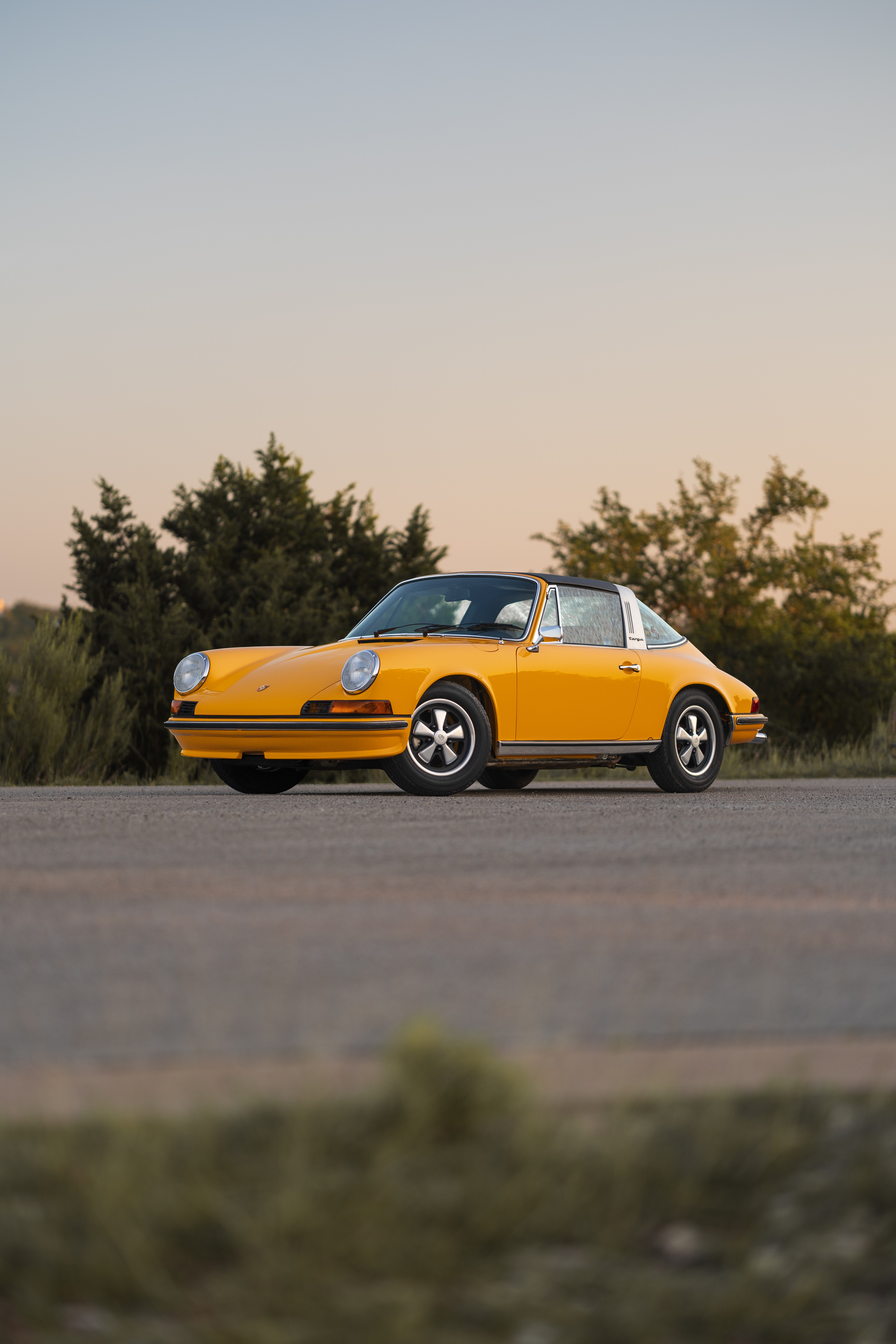 A Signal Yellow 1973 Porsche 911S Targa with brown interior in Austin, TX.