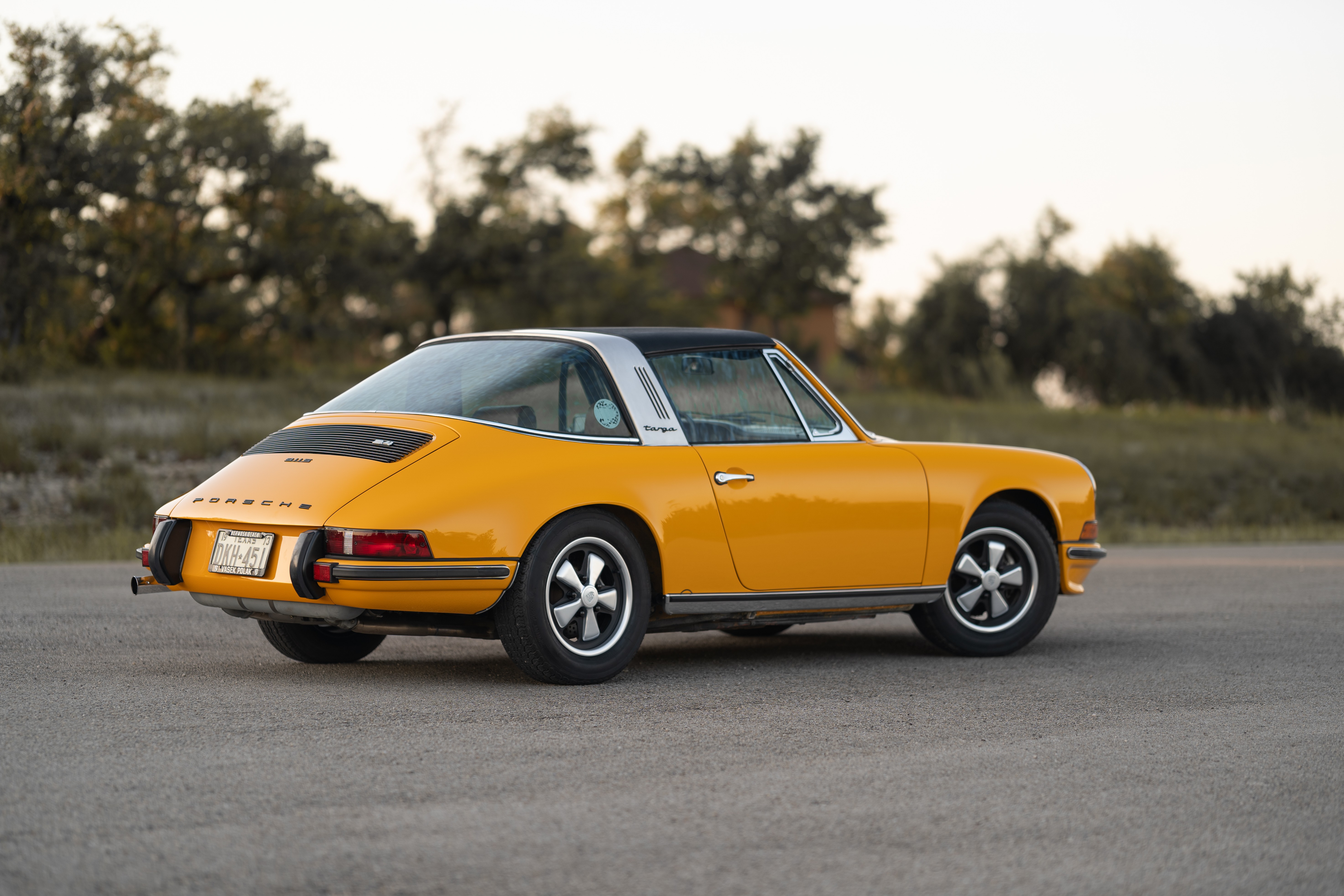 A Signal Yellow 1973 Porsche 911S Targa with brown interior in Austin, TX.