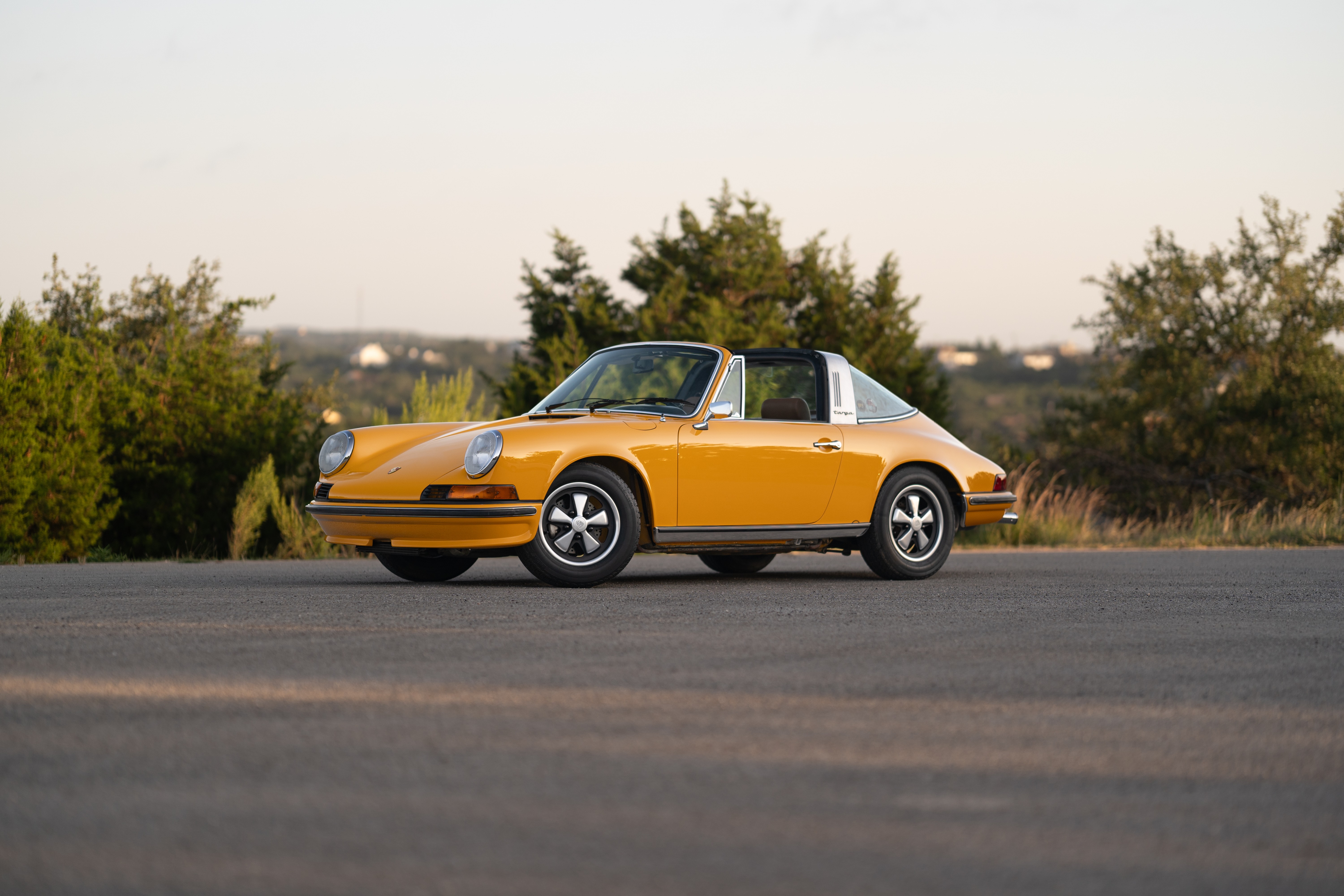 A Signal Yellow 1973 Porsche 911S Targa with brown interior in Austin, TX.