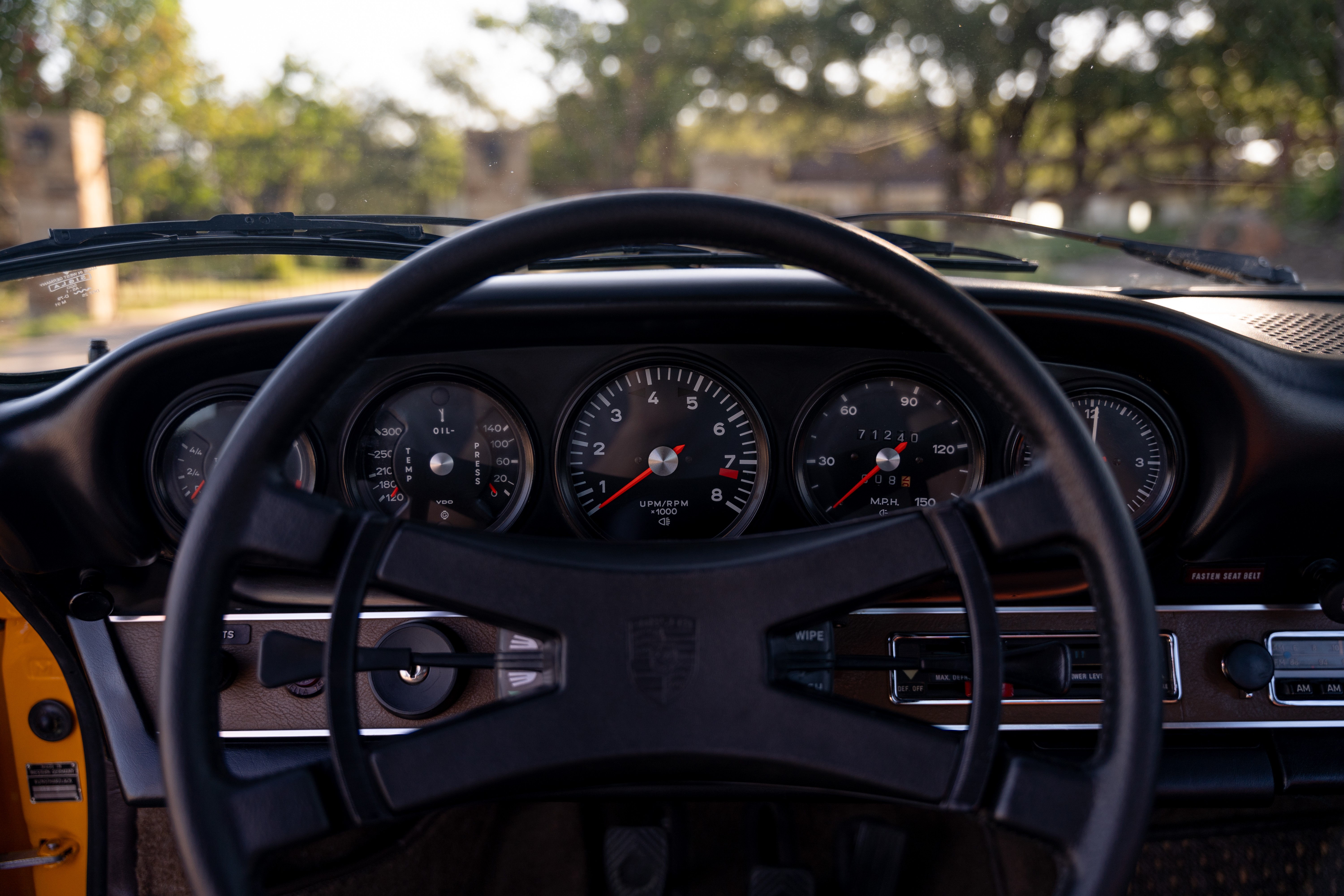 A Signal Yellow 1973 Porsche 911S Targa with brown interior in Austin, TX.