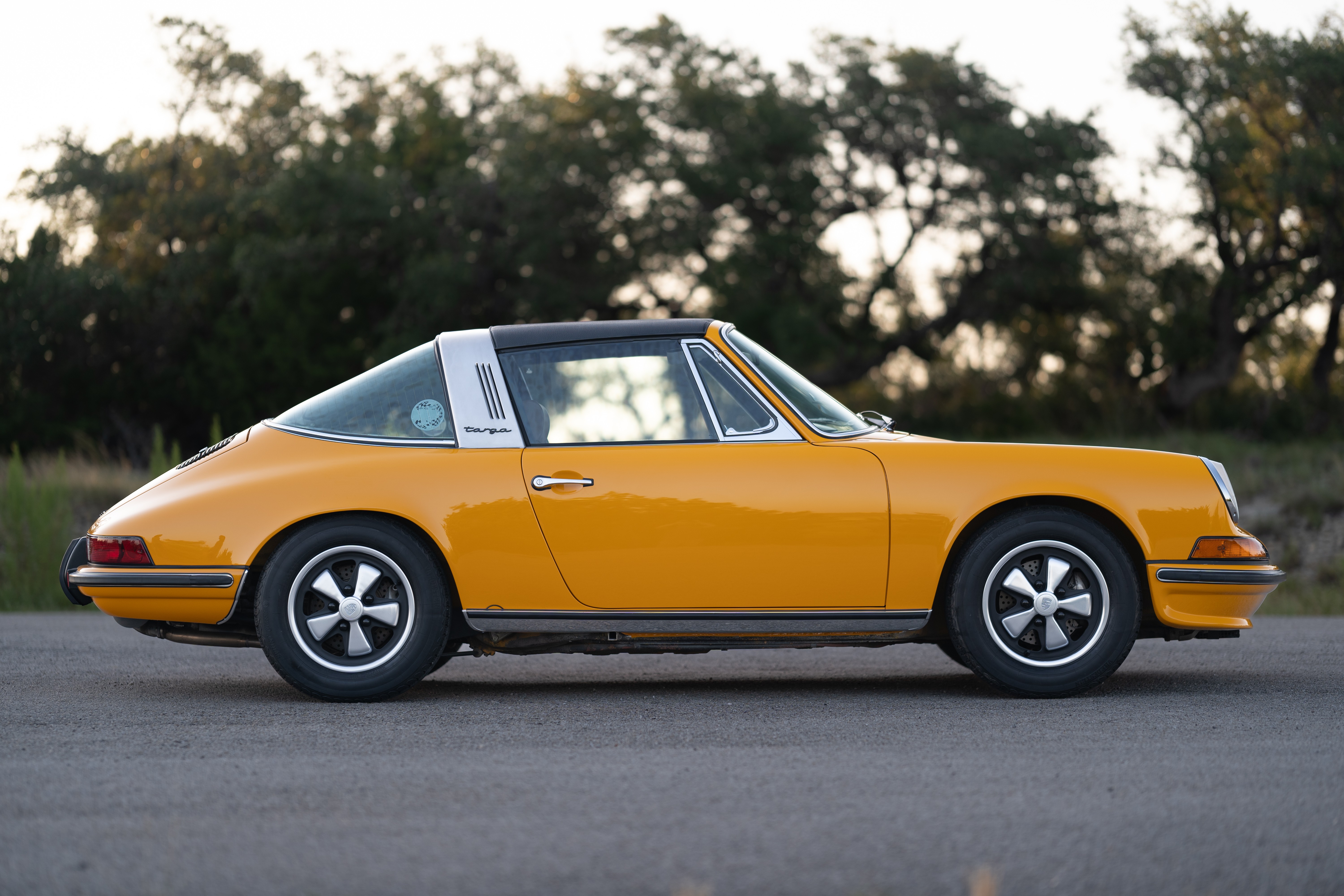 A Signal Yellow 1973 Porsche 911S Targa with brown interior in Austin, TX.