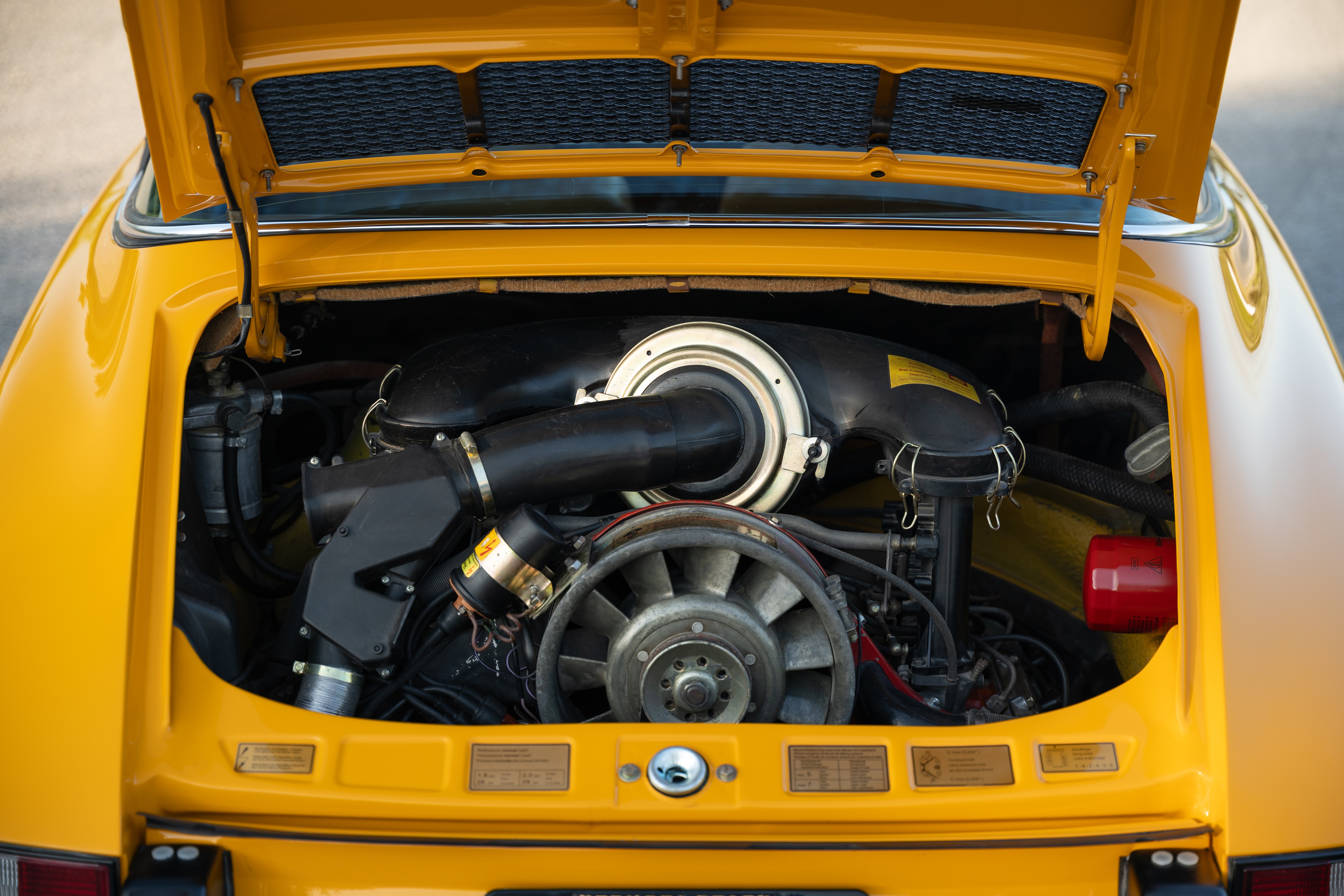 A Signal Yellow 1973 Porsche 911S Targa with brown interior in Austin, TX.