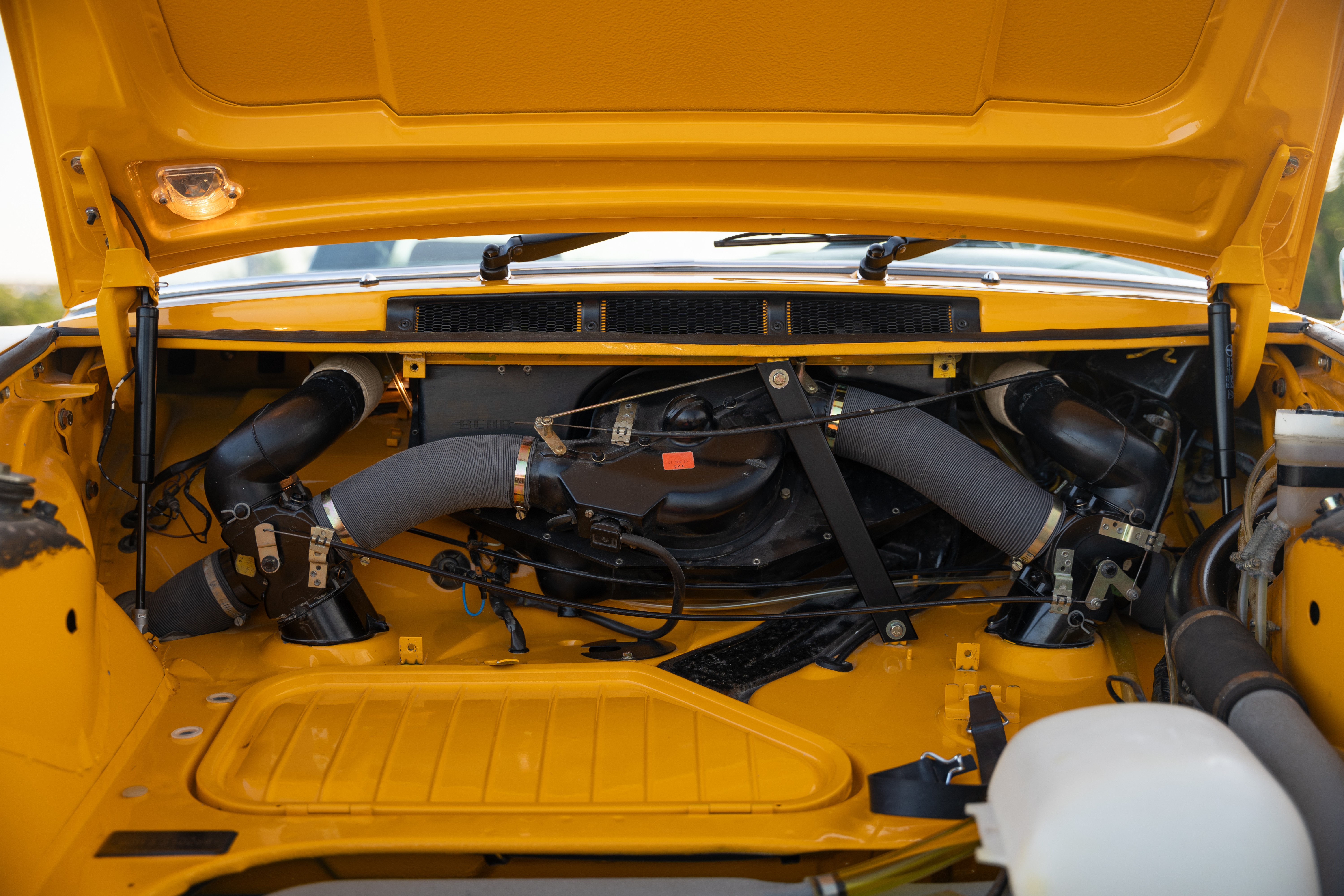 A Signal Yellow 1973 Porsche 911S Targa with brown interior in Austin, TX.