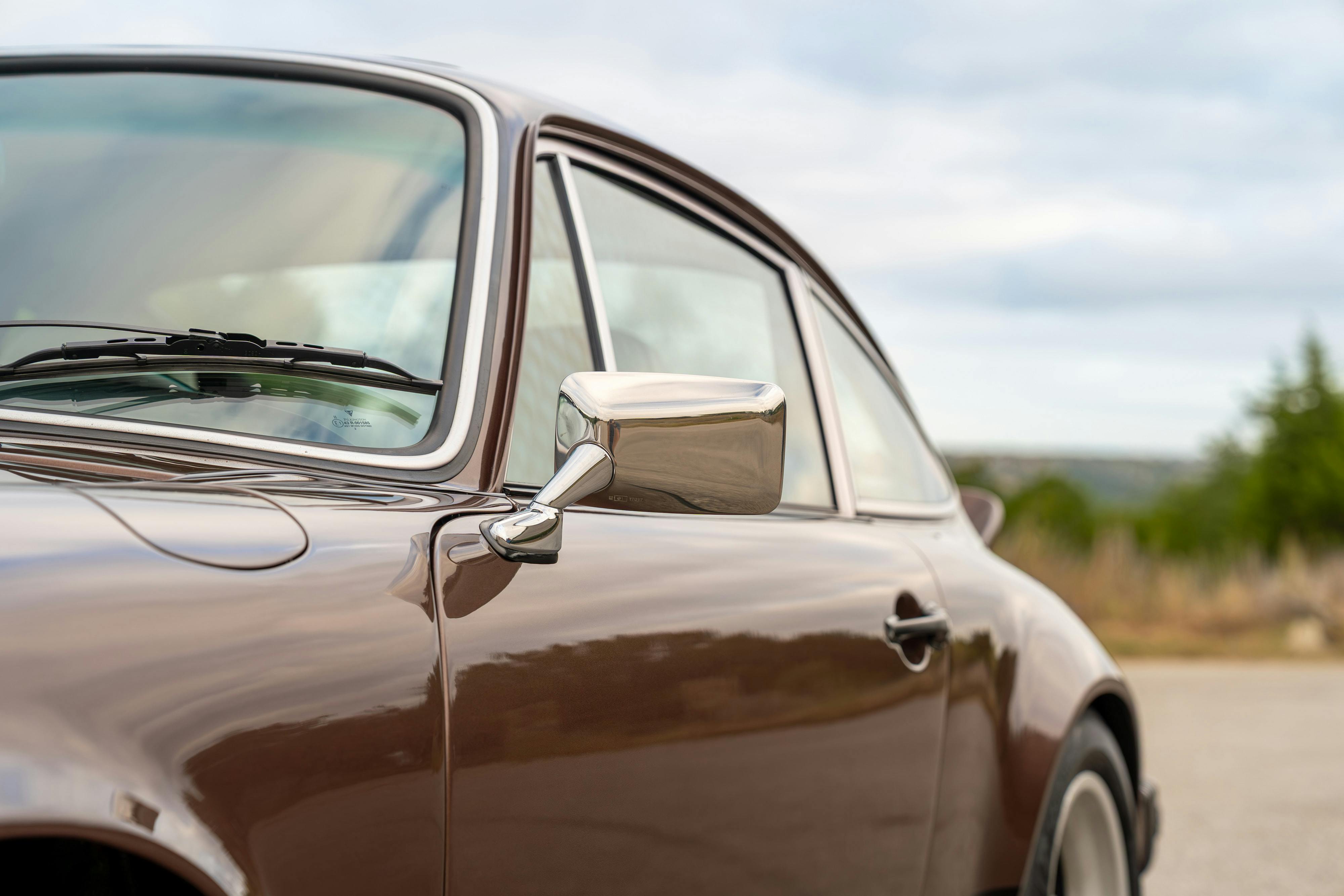 1975 Porsche 911 Carrera 2.7 in Copper Brown Metallic with beige interior for auction on Bring a Trailer.