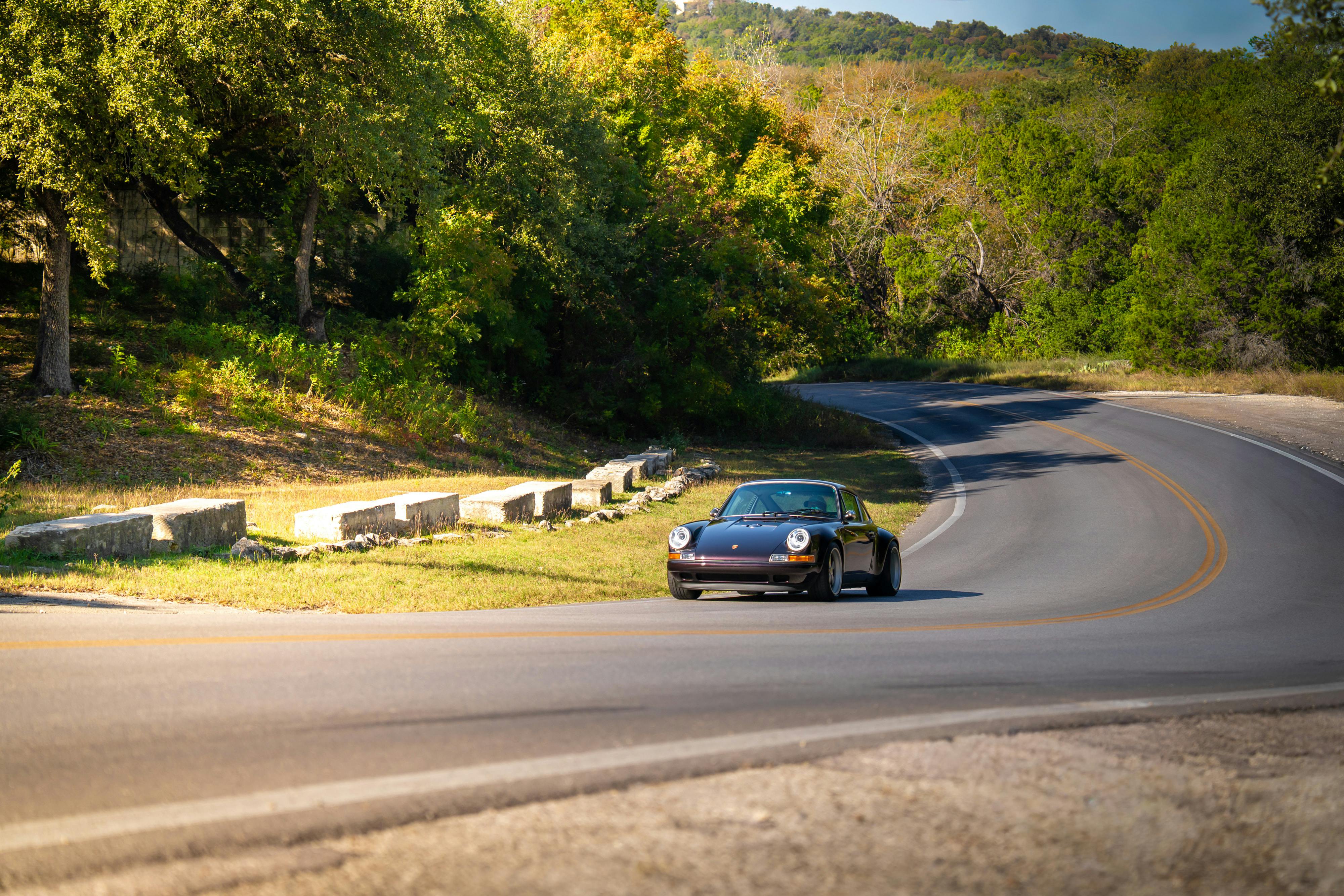 1990 Singer Porsche 911 Carrera 2 "Austin" commission in Aubergine Metallic shot in Austin, TX for a Bring a Trailer auction.