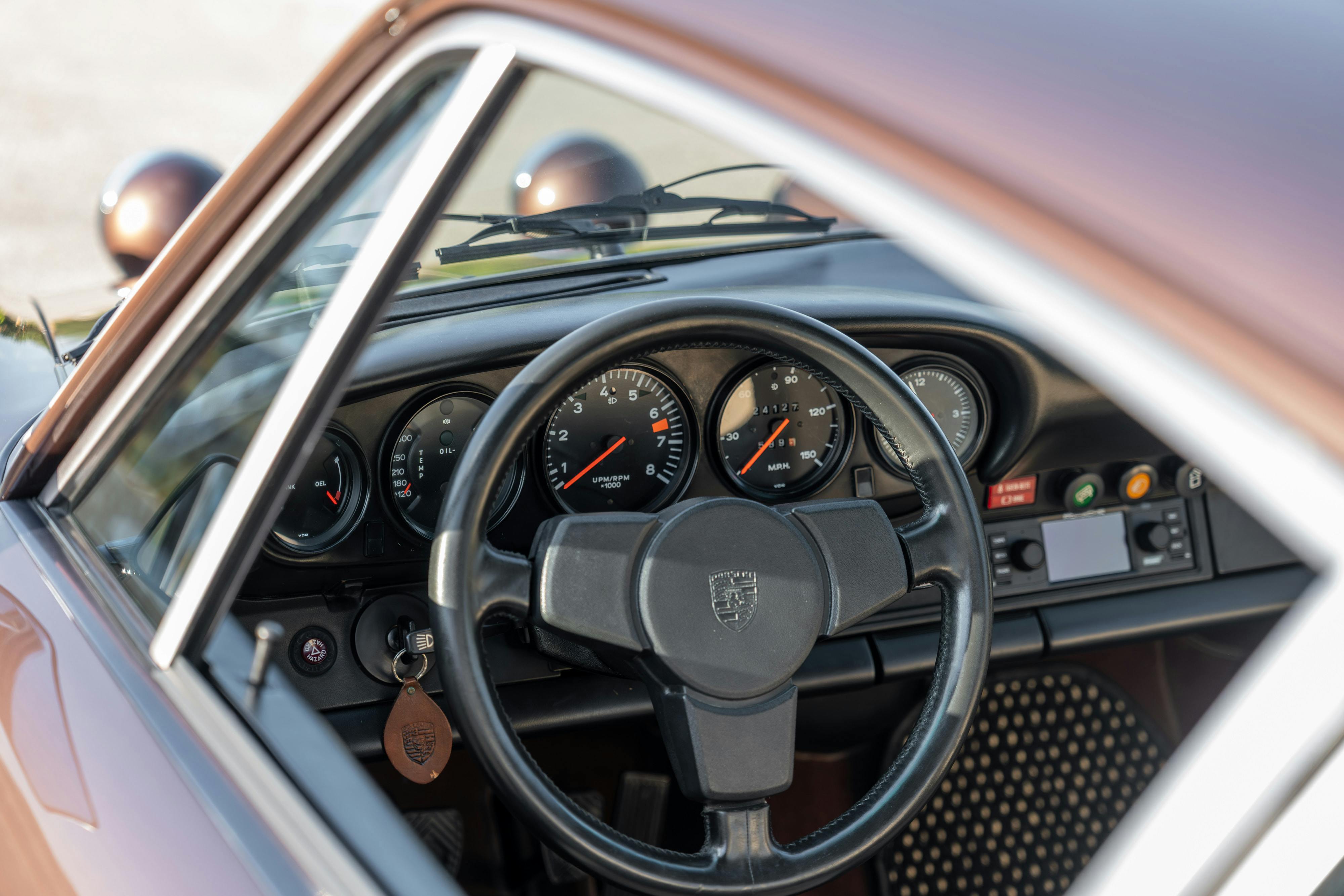 1975 Porsche 911 Carrera 2.7 in Copper Brown Metallic with beige interior for auction on Bring a Trailer.