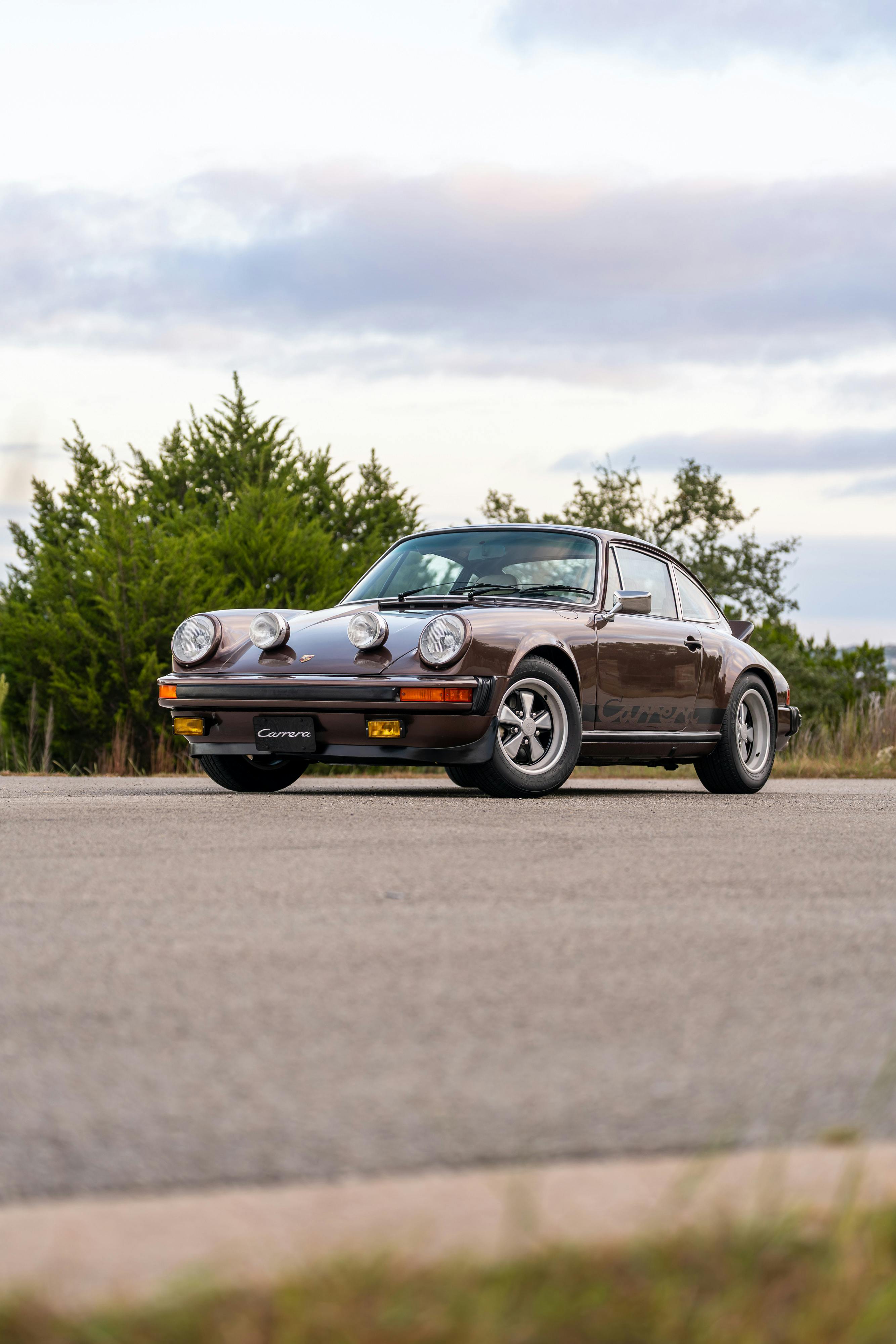 1975 Porsche 911 Carrera 2.7 in Copper Brown Metallic with beige interior for auction on Bring a Trailer.