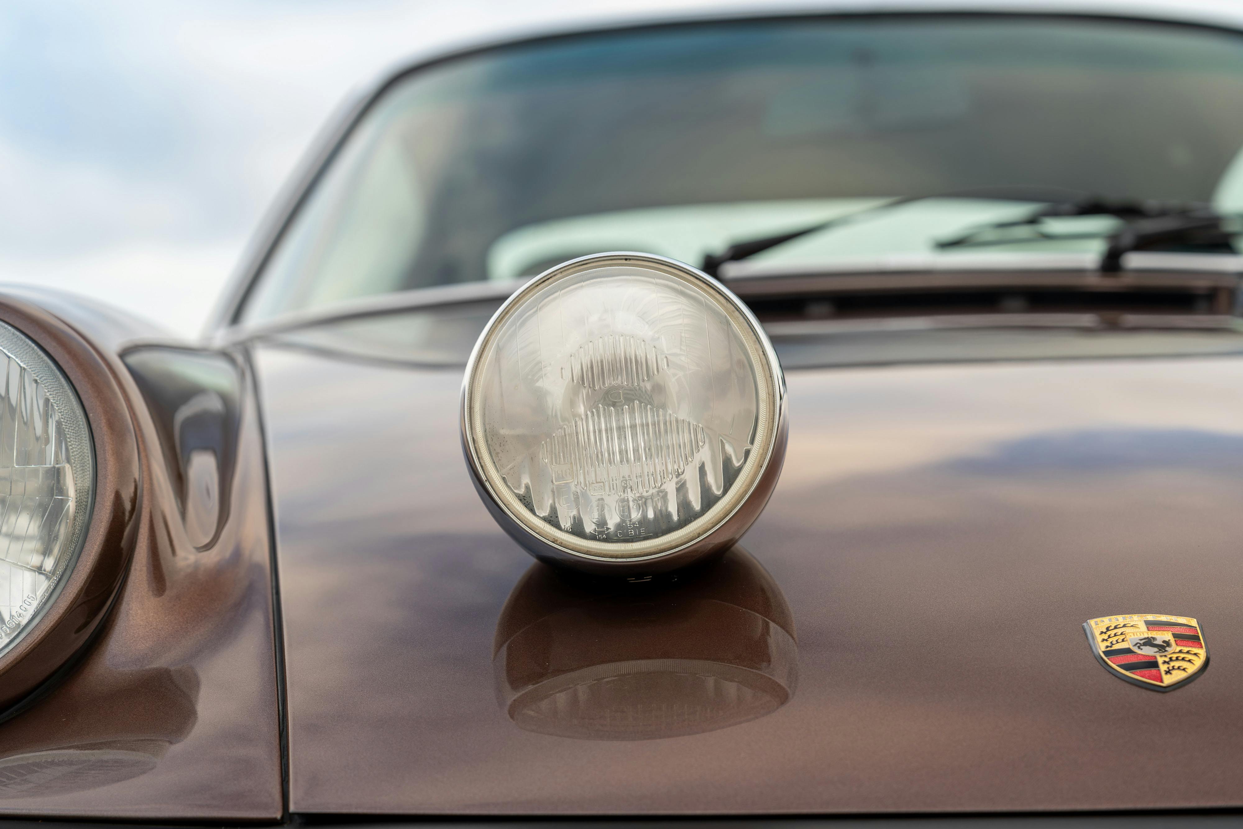 1975 Porsche 911 Carrera 2.7 in Copper Brown Metallic with beige interior for auction on Bring a Trailer.