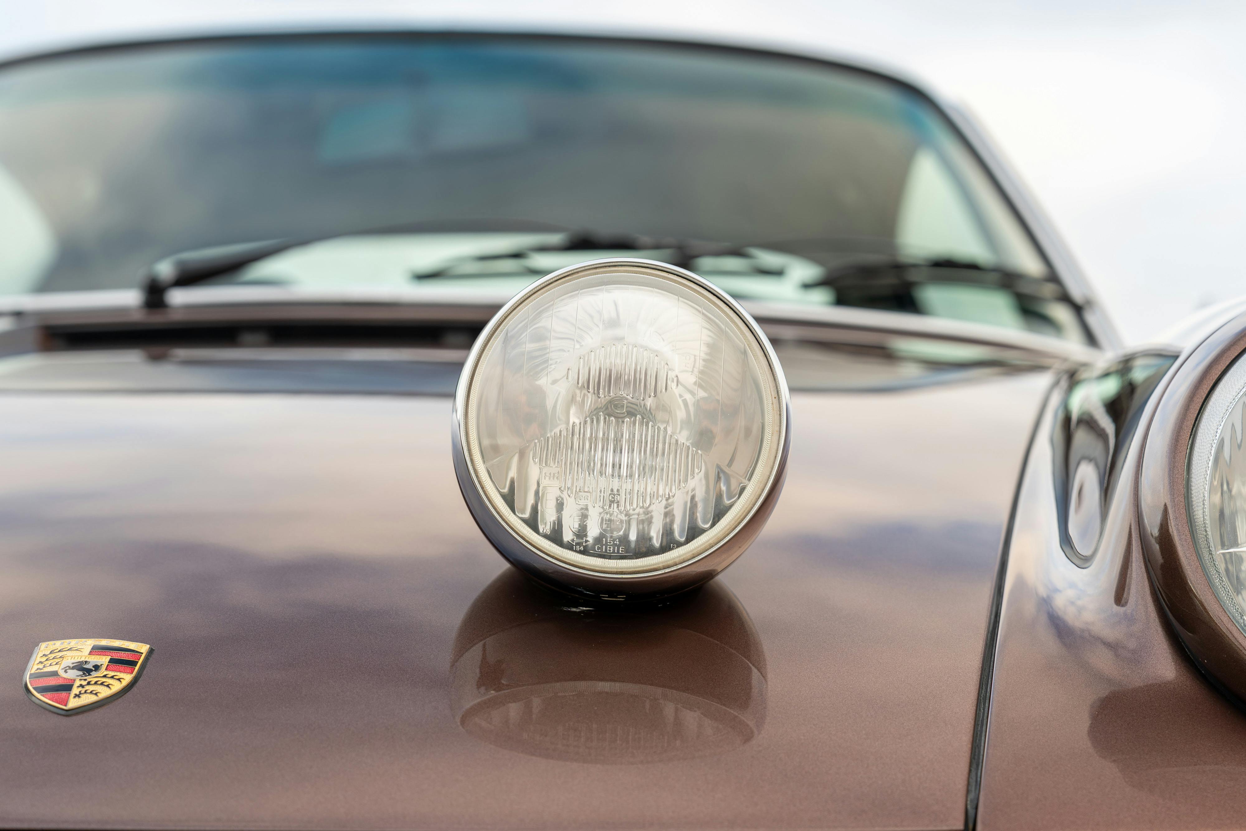 1975 Porsche 911 Carrera 2.7 in Copper Brown Metallic with beige interior for auction on Bring a Trailer.
