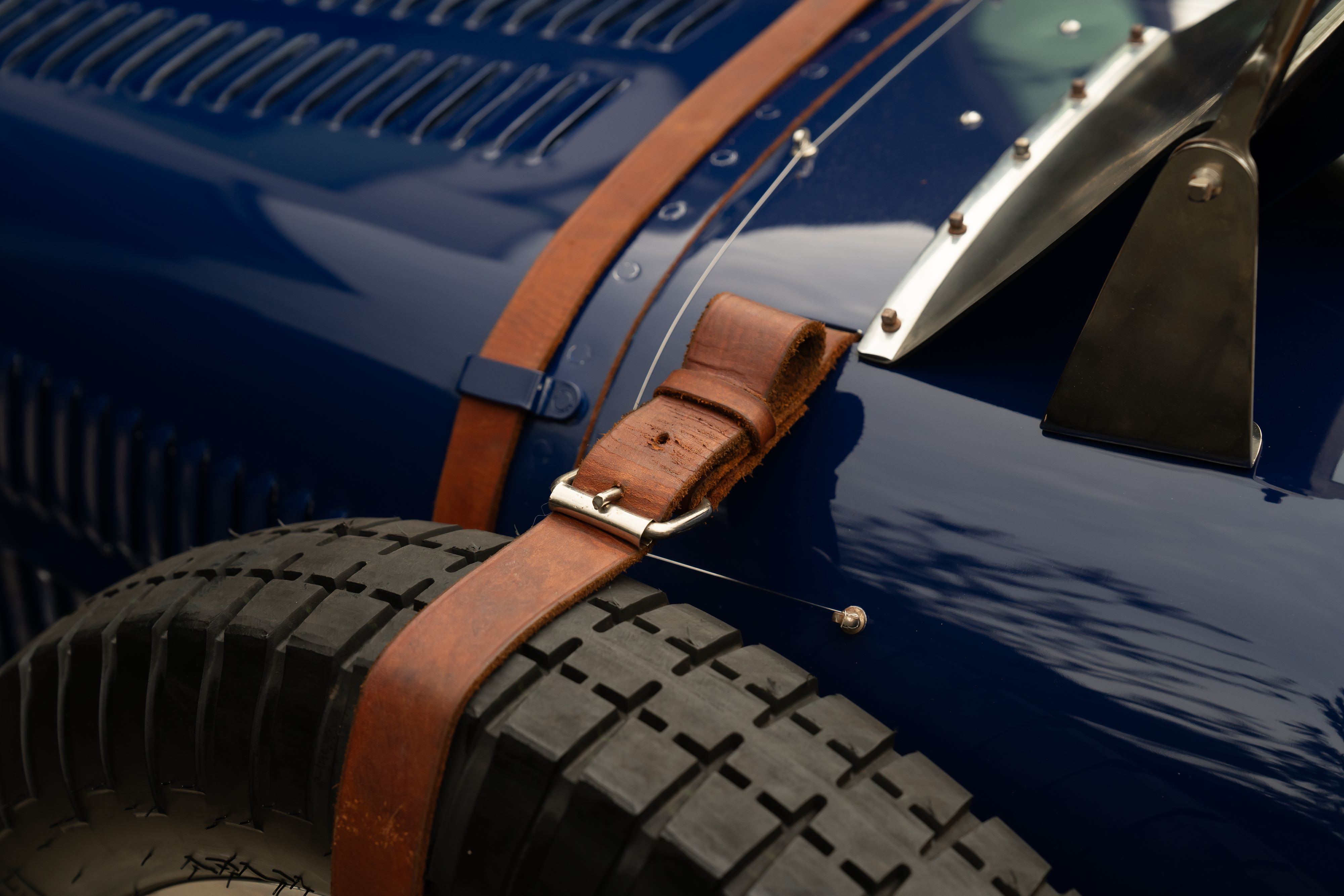 Spare tire on a Pur Sang Bugatti Type 35 in Blue over Brown shot in Austin, TX.