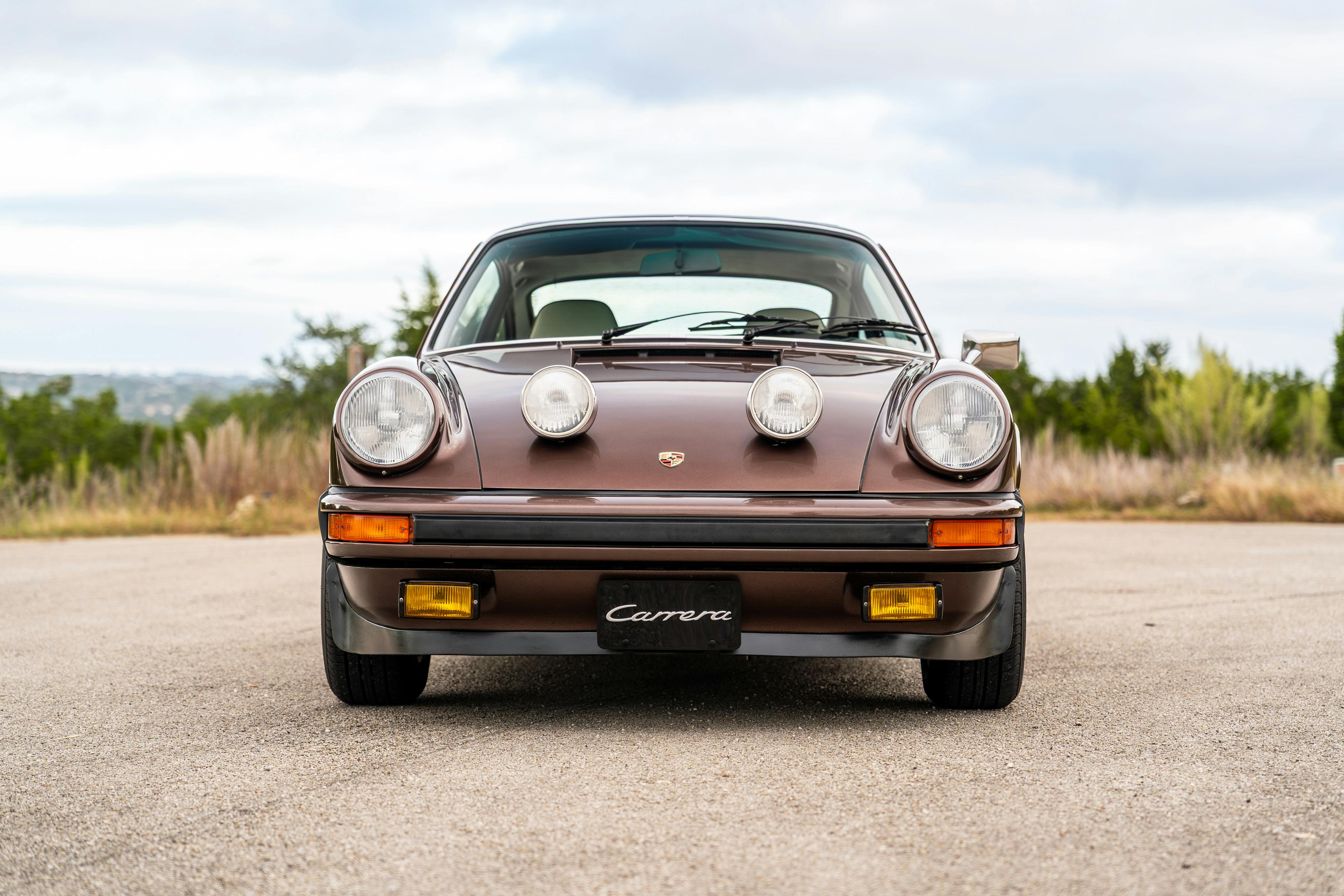 1975 Porsche 911 Carrera 2.7 in Copper Brown Metallic with beige interior for auction on Bring a Trailer.