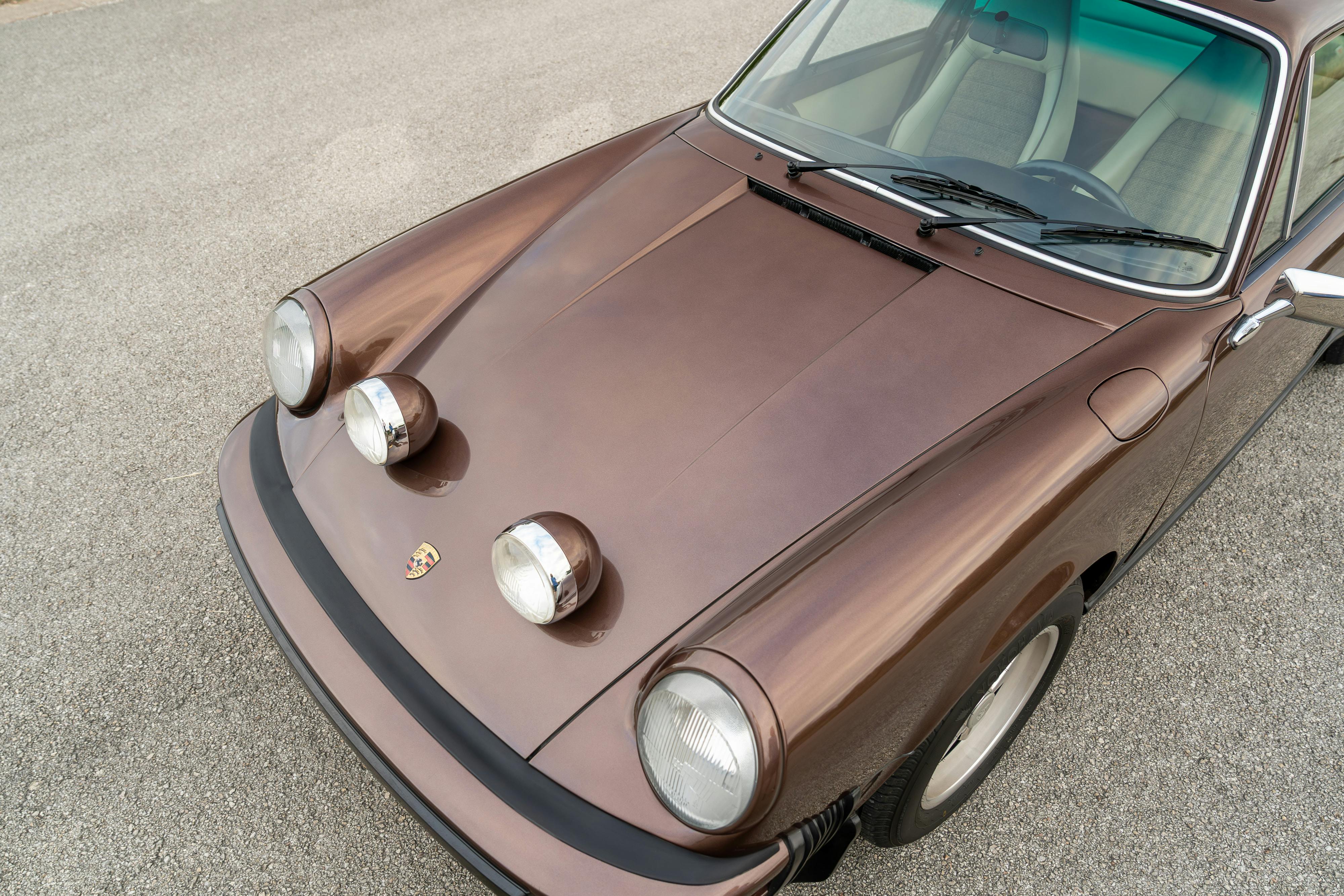 1975 Porsche 911 Carrera 2.7 in Copper Brown Metallic with beige interior for auction on Bring a Trailer.