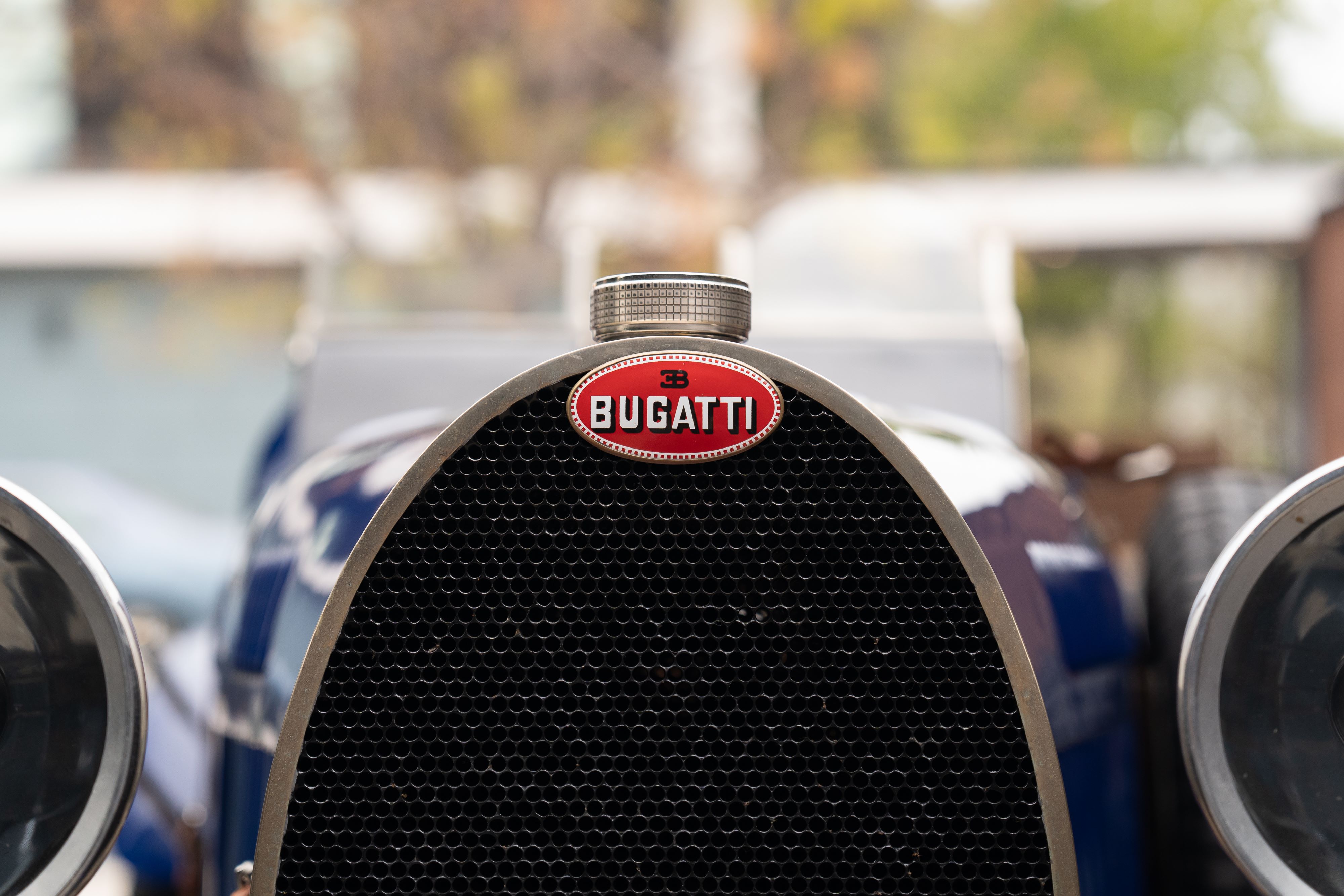 Bugatti badging on a Pur Sang Bugatti Type 35 in Blue over Brown shot in Austin, TX.