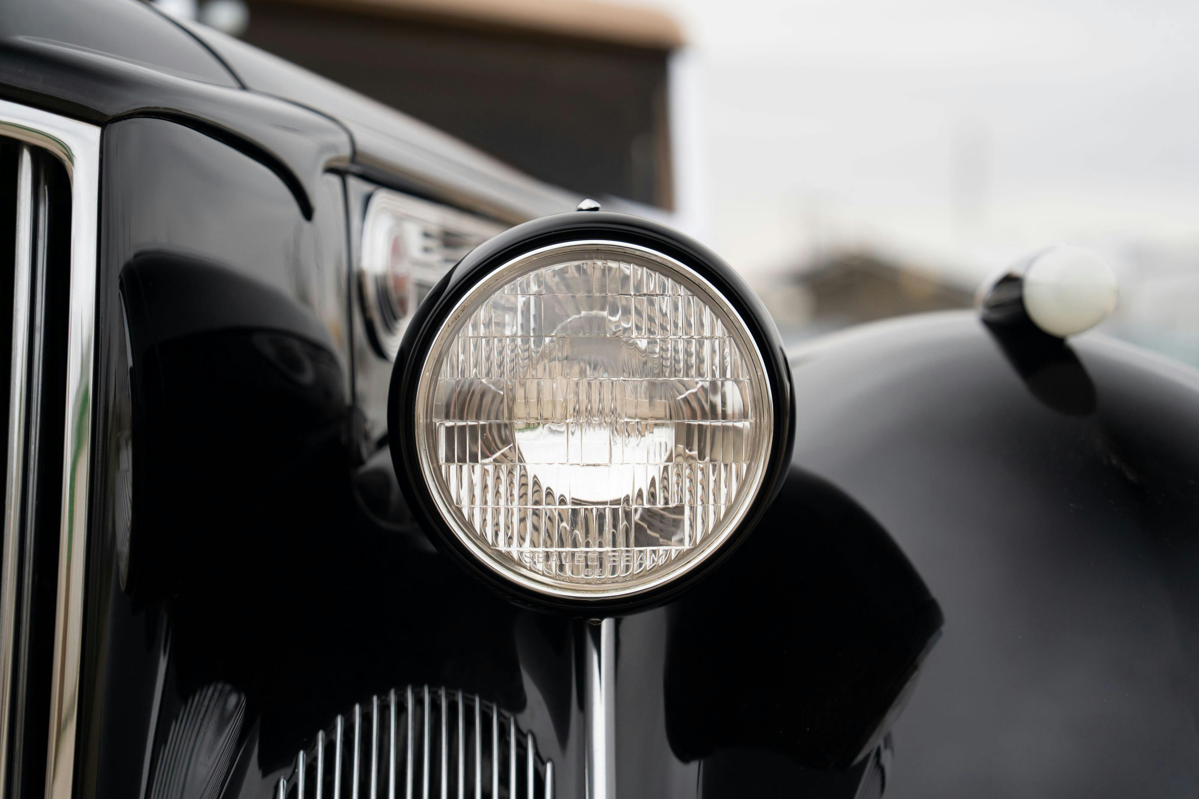 Headlight of a 1940 Packard Super Eight One-Eighty Convertible Sedan by Darrin in Georgetown, TX.