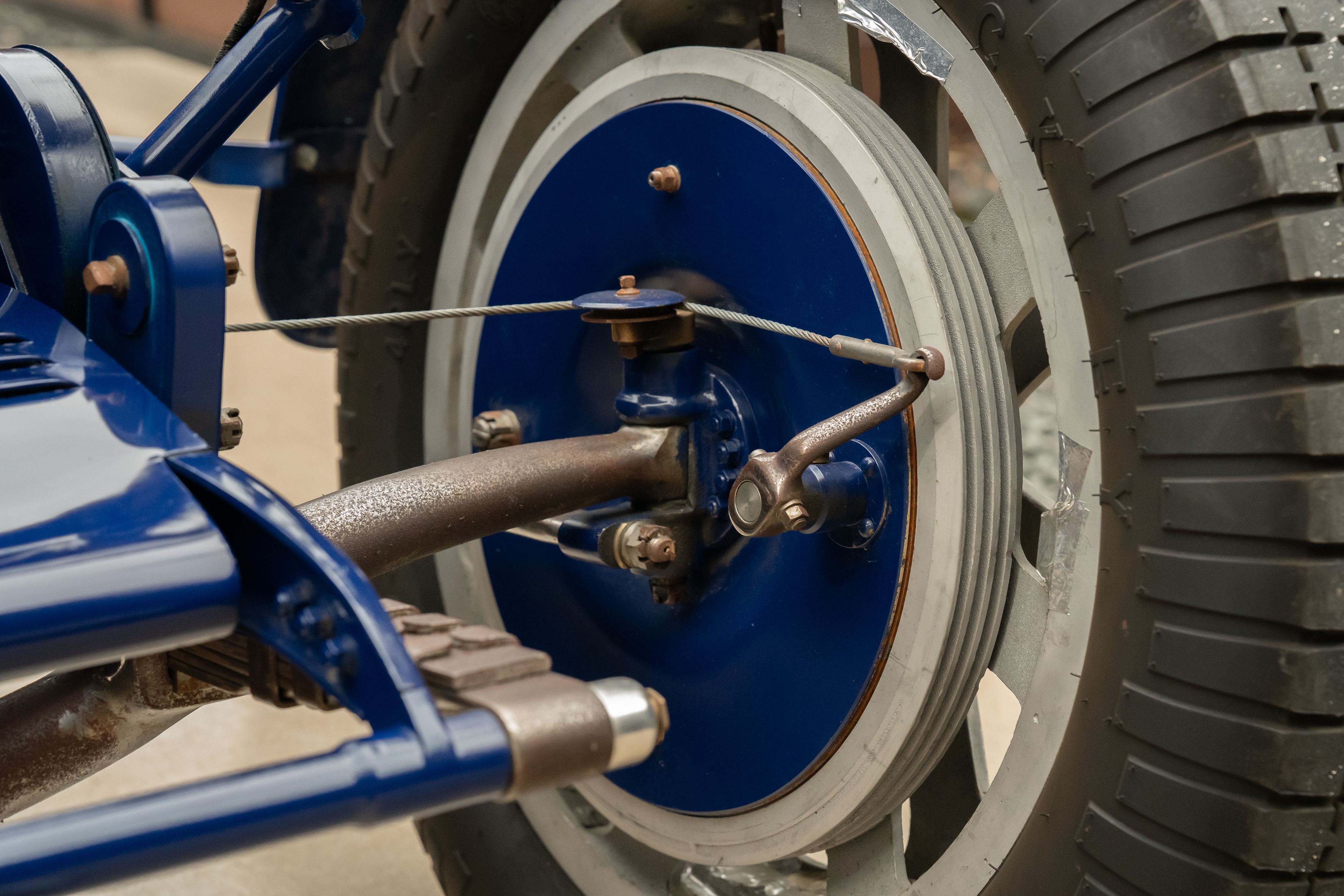 Front suspension on a Pur Sang Bugatti Type 35 in Blue over Brown shot in Austin, TX.