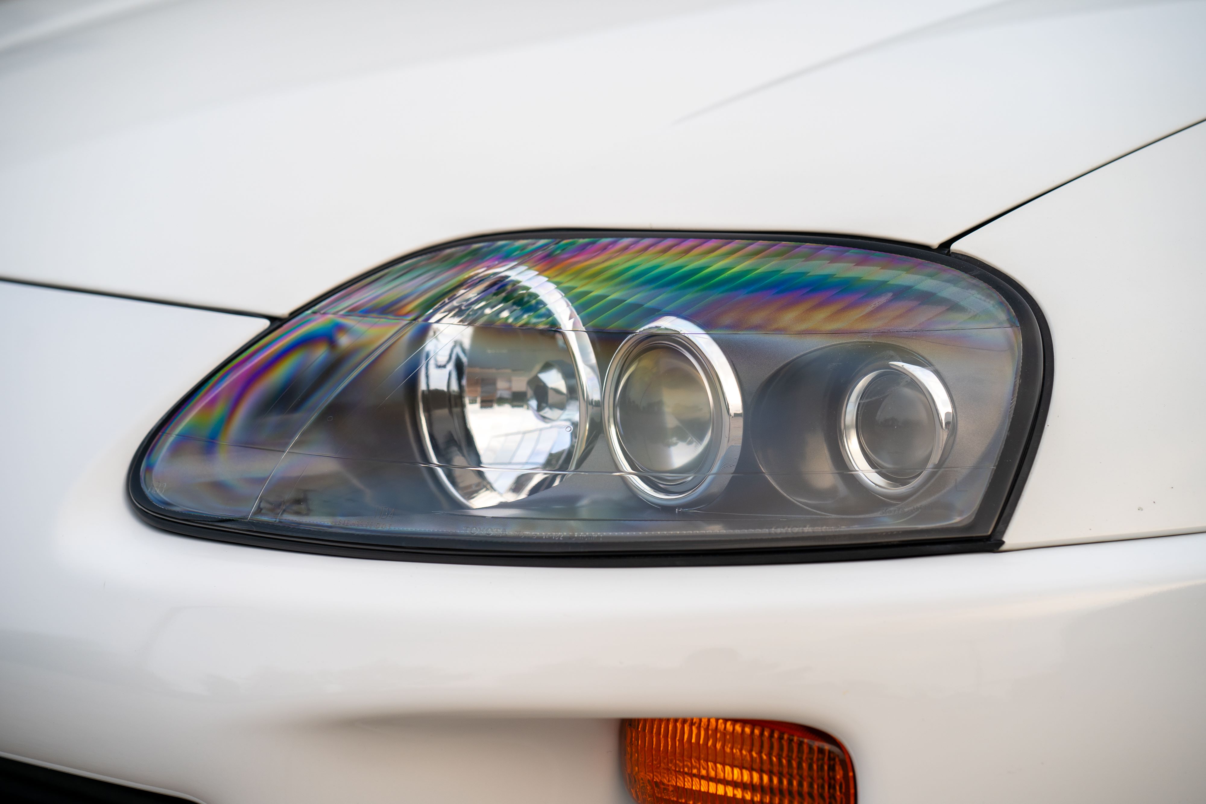 S2 Headlights on a MK4 White Toyota Supra in Austin, TX.