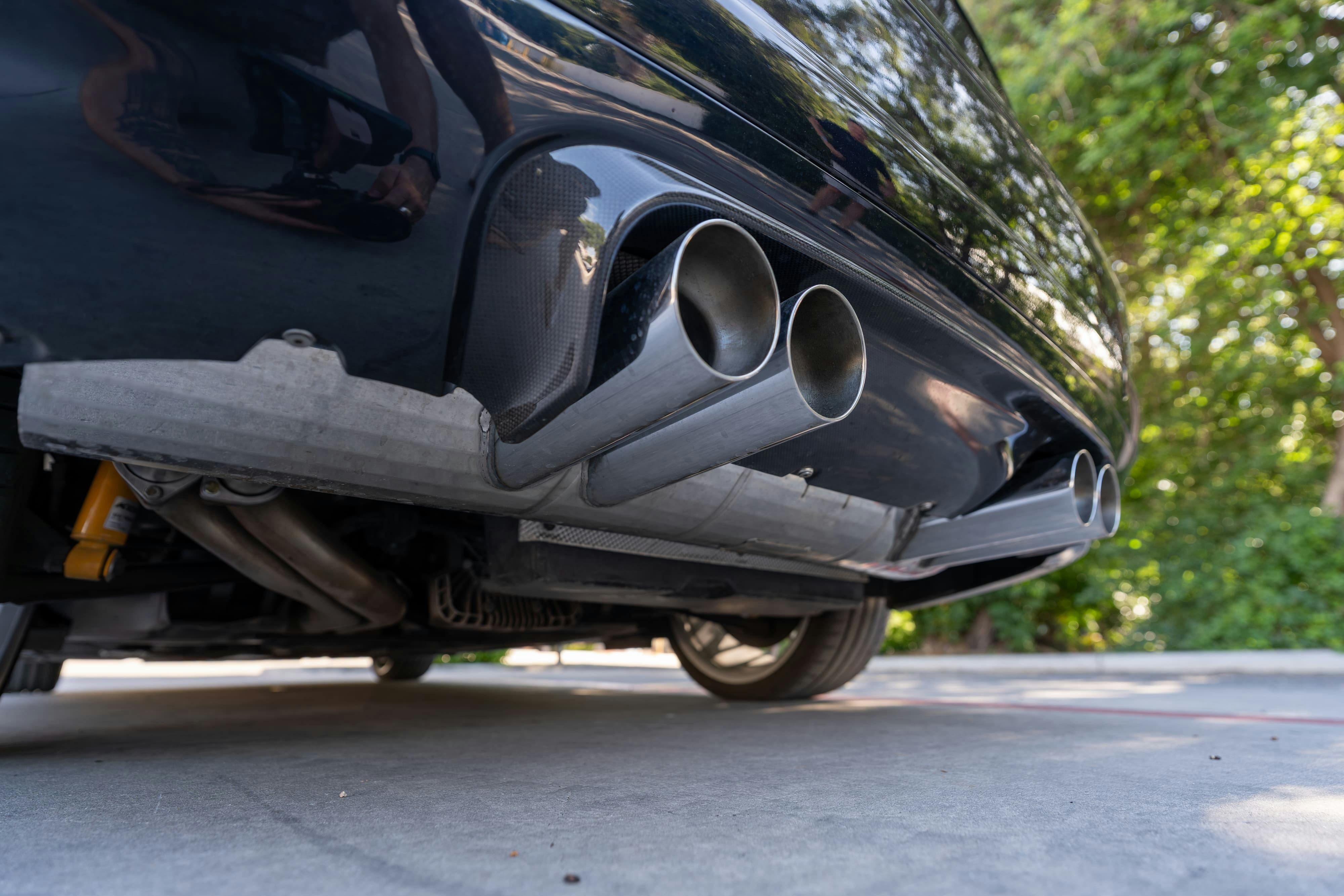 Eisenmann exhaust on an Individual Carbon Black 2002 BMW M3 6-Speed in San Antonio, TX.
