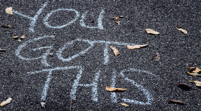 "You Got This" written in chalk on asphalt