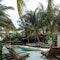 Beneath the sun's warm kiss, fresh dive in Mia's pool