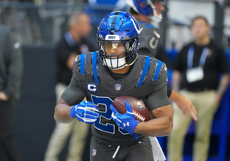 Colts running back Jonathan Taylor carries the ball during an NFL game