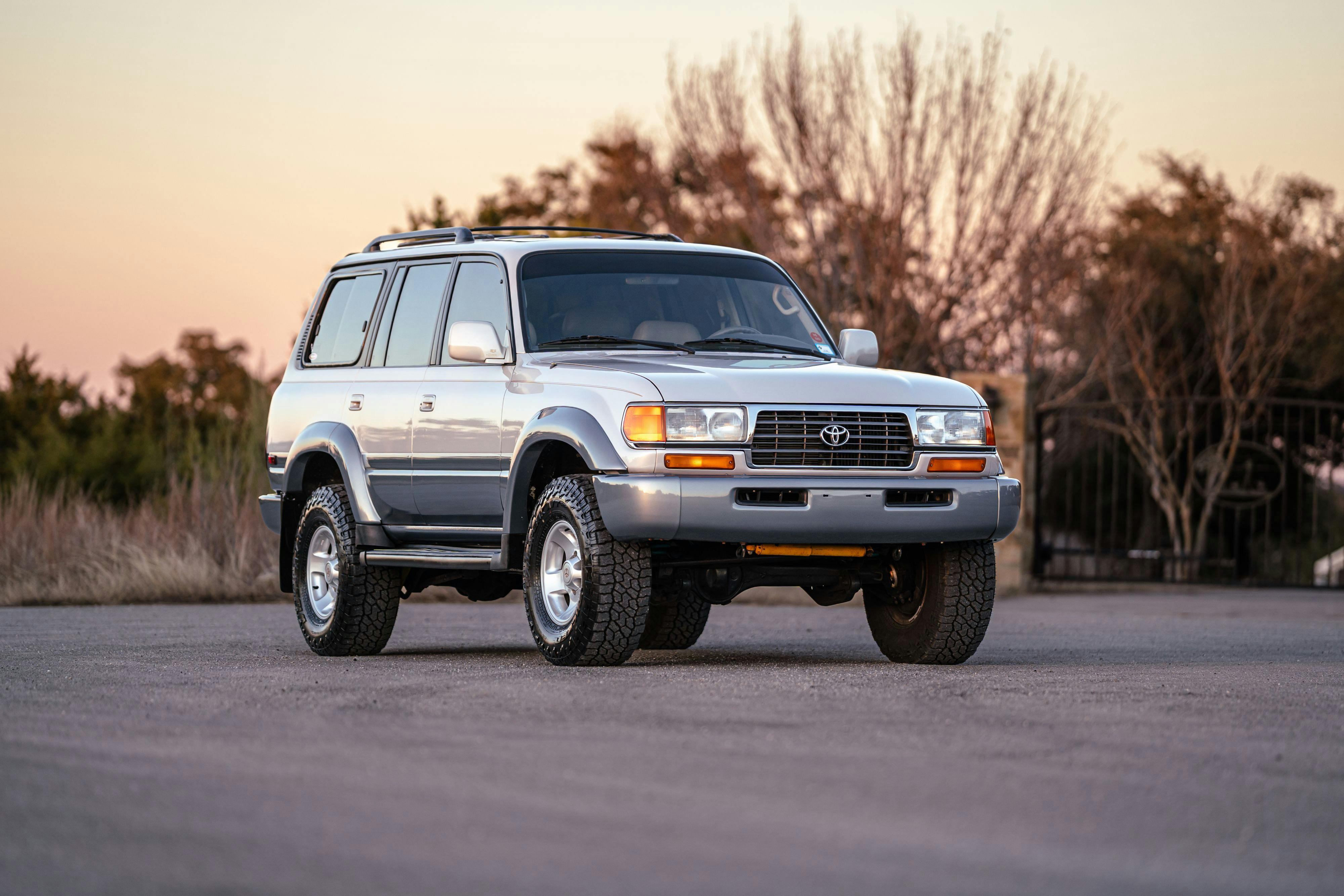 1997 Toyota Land Cruiser FJZ80 in Desert Dune Metallic with Moonglow Pearl cladding.