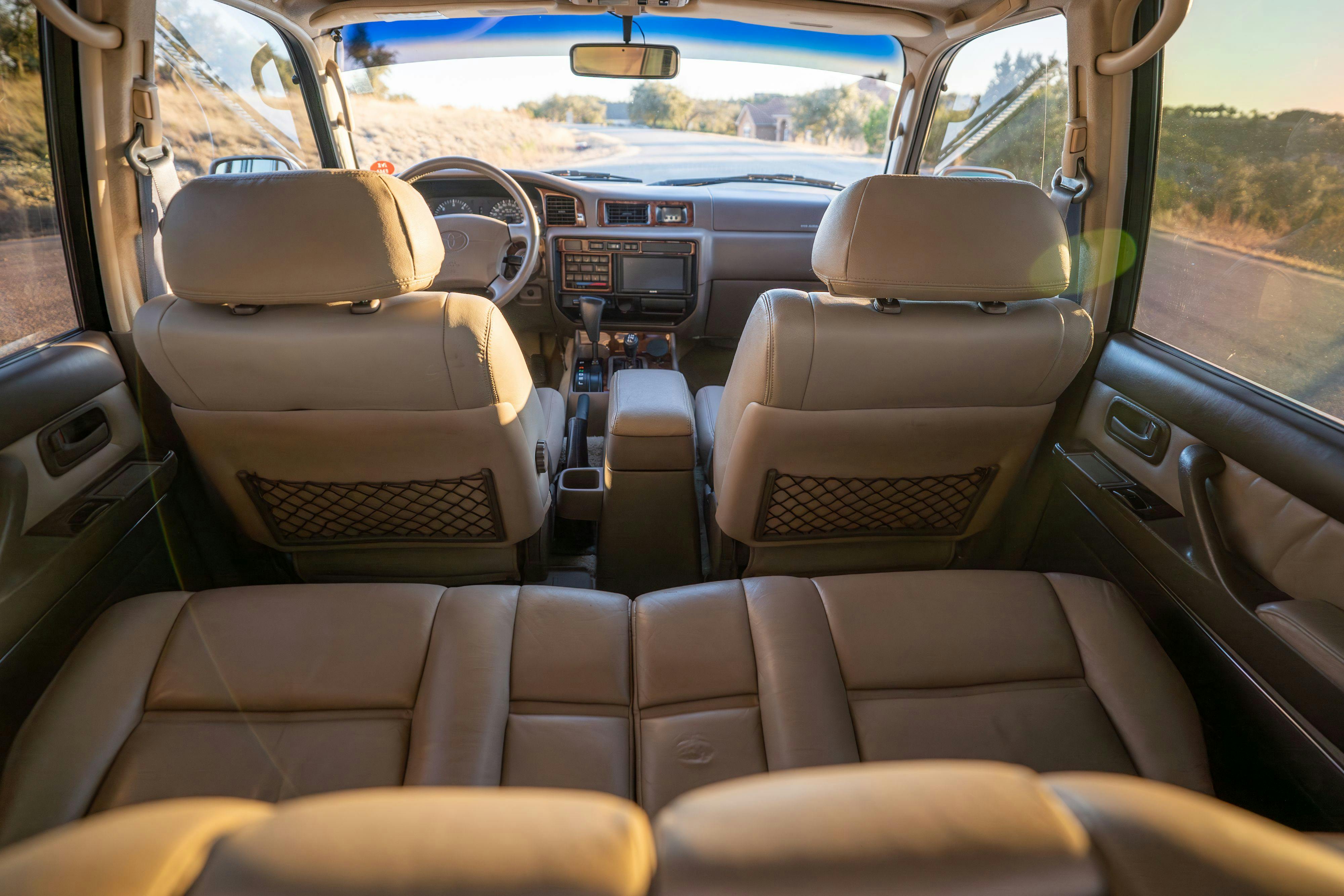 1997 Toyota Land Cruiser FJZ80 interior in Desert Dune Metallic with Moonglow Pearl cladding.