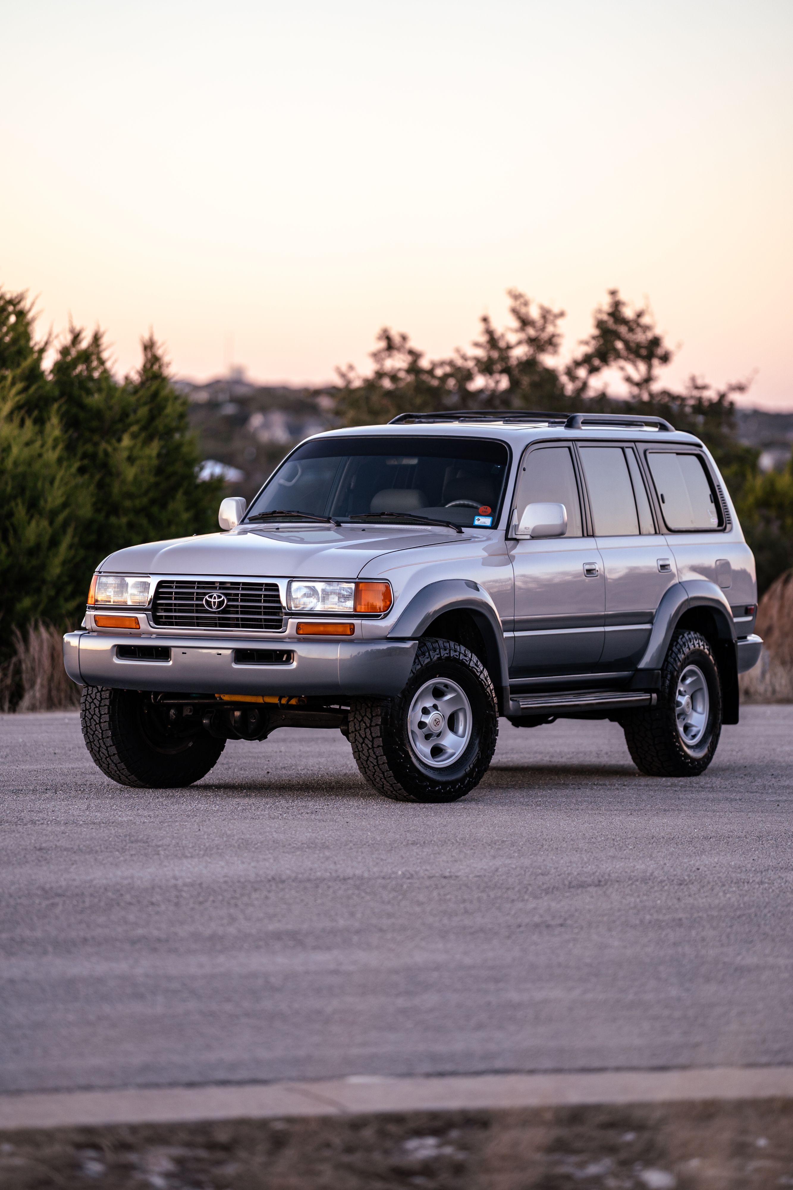 1997 Toyota Land Cruiser FJZ80 in Desert Dune Metallic with Moonglow Pearl cladding.