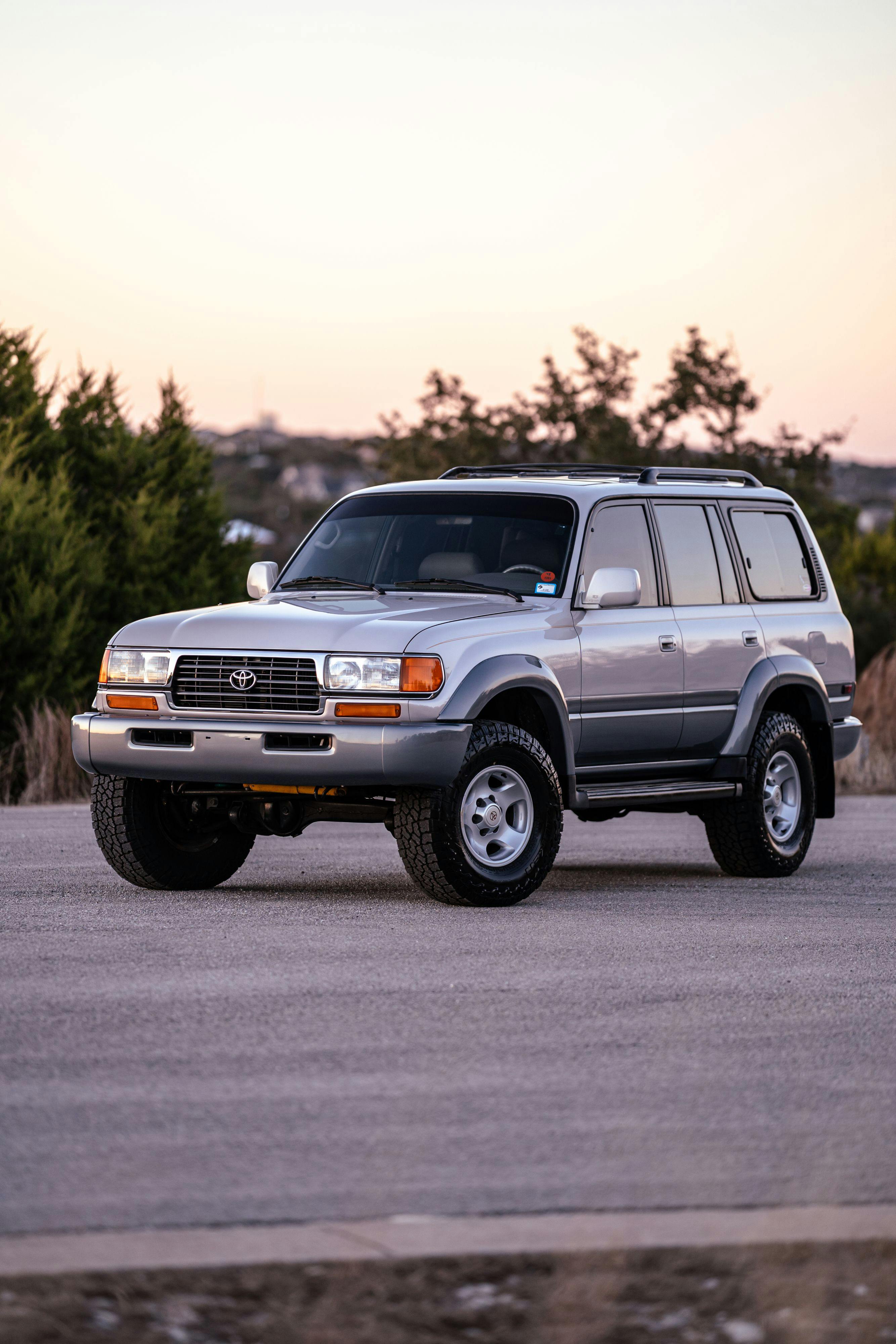 1997 Toyota Land Cruiser FJZ80 in Desert Dune Metallic with Moonglow Pearl cladding.