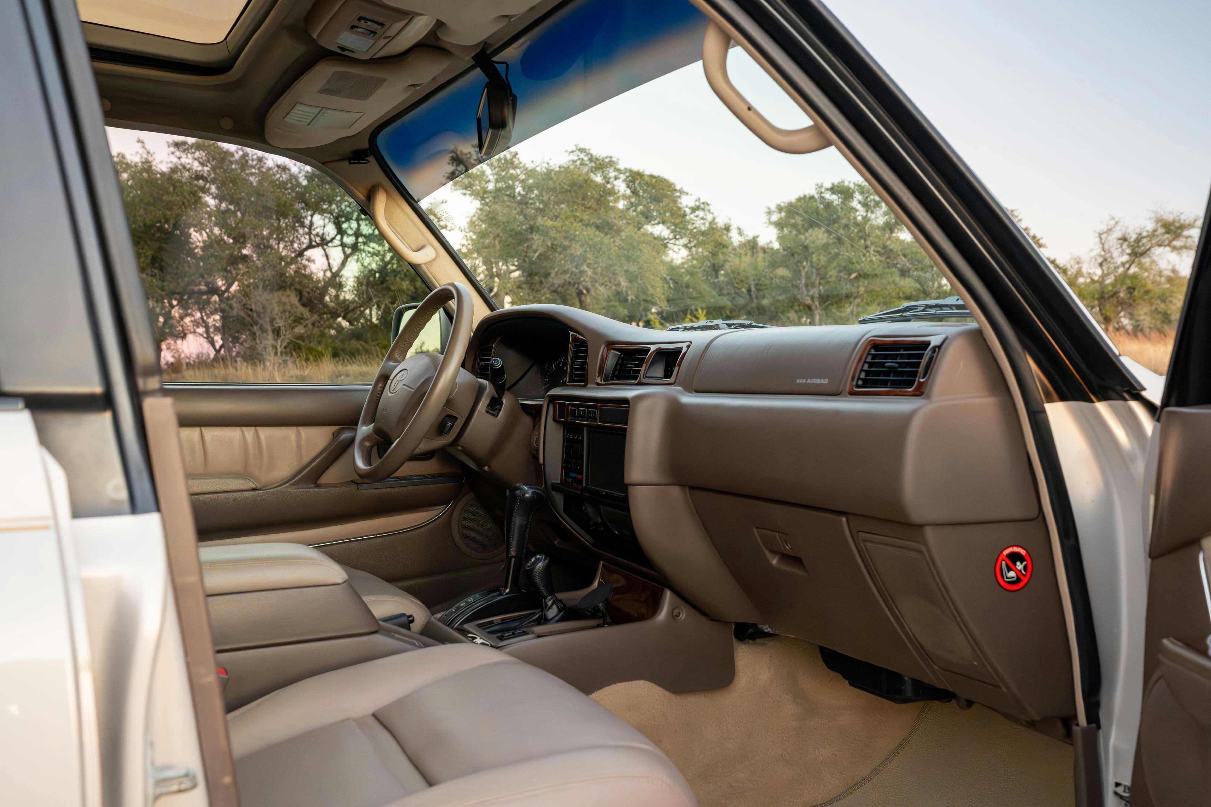 1997 Toyota Land Cruiser FJZ80 interior in Desert Dune Metallic with Moonglow Pearl cladding.