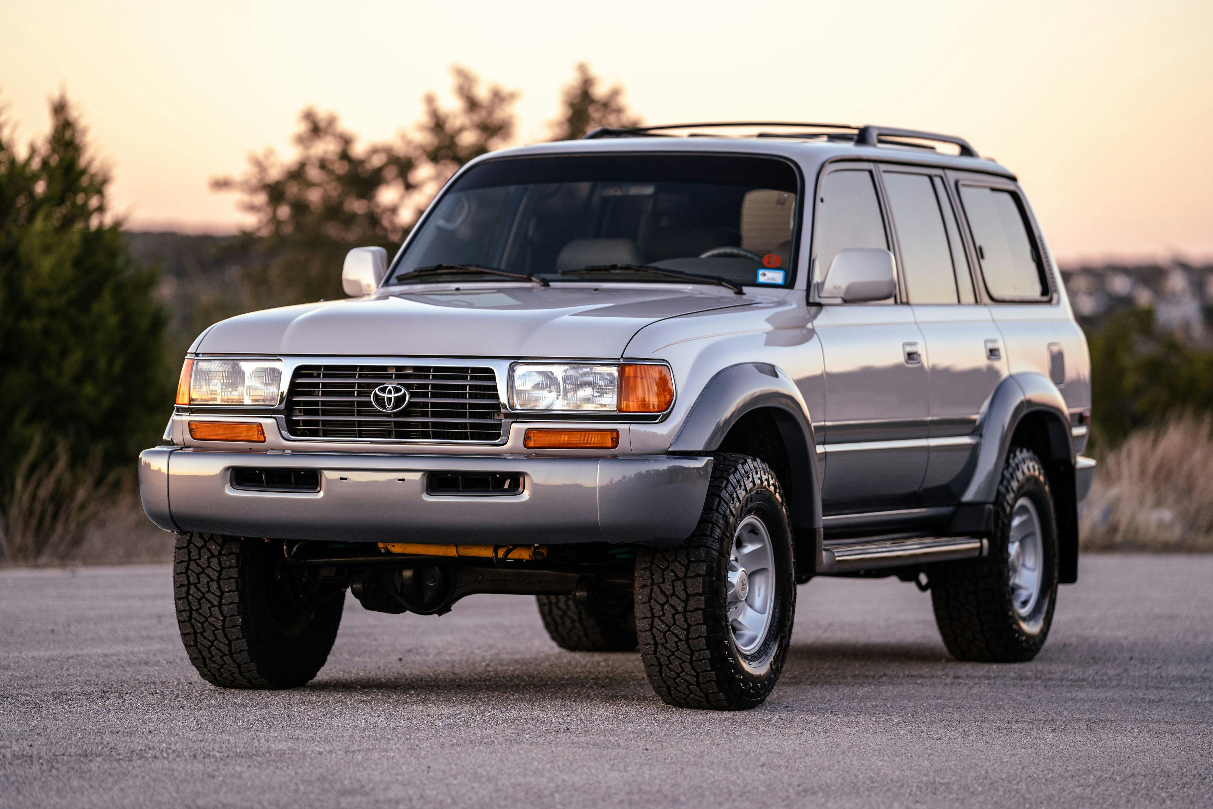 1997 Toyota Land Cruiser FJZ80 in Desert Dune Metallic with Moonglow Pearl cladding.