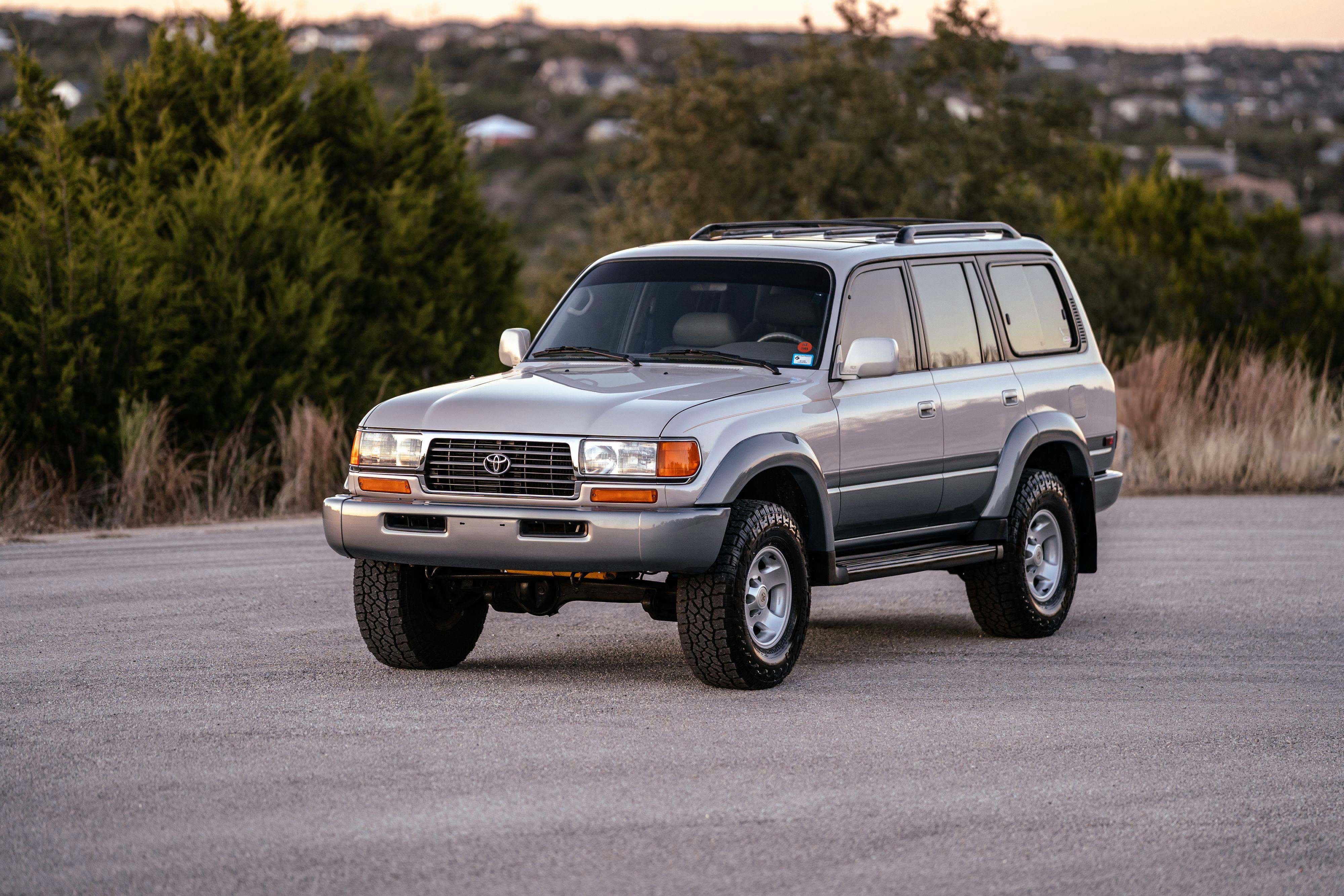 1997 Toyota Land Cruiser FJZ80 in Desert Dune Metallic with Moonglow Pearl cladding.