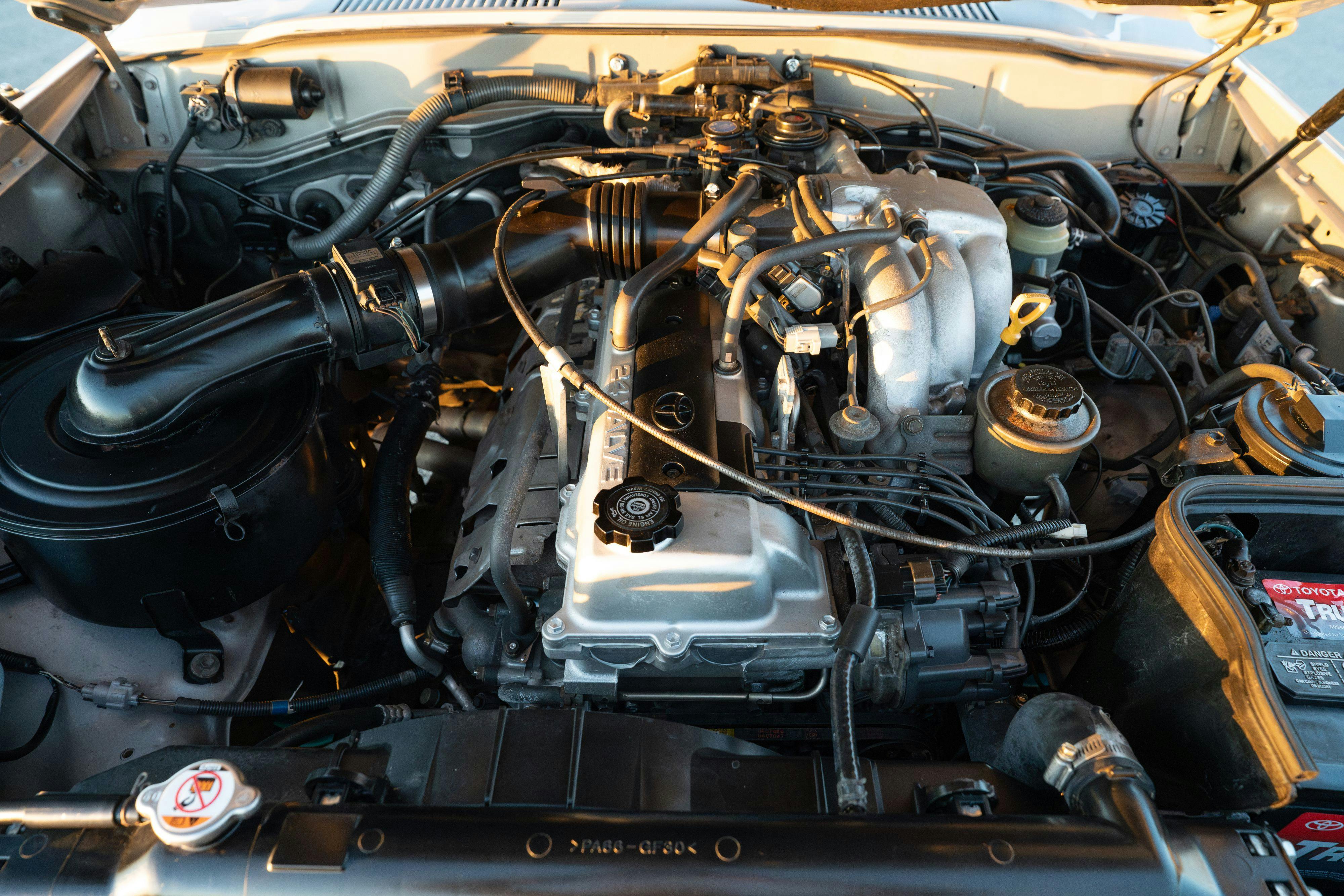 1997 Toyota Land Cruiser FJZ80 engine in Desert Dune Metallic with Moonglow Pearl cladding.