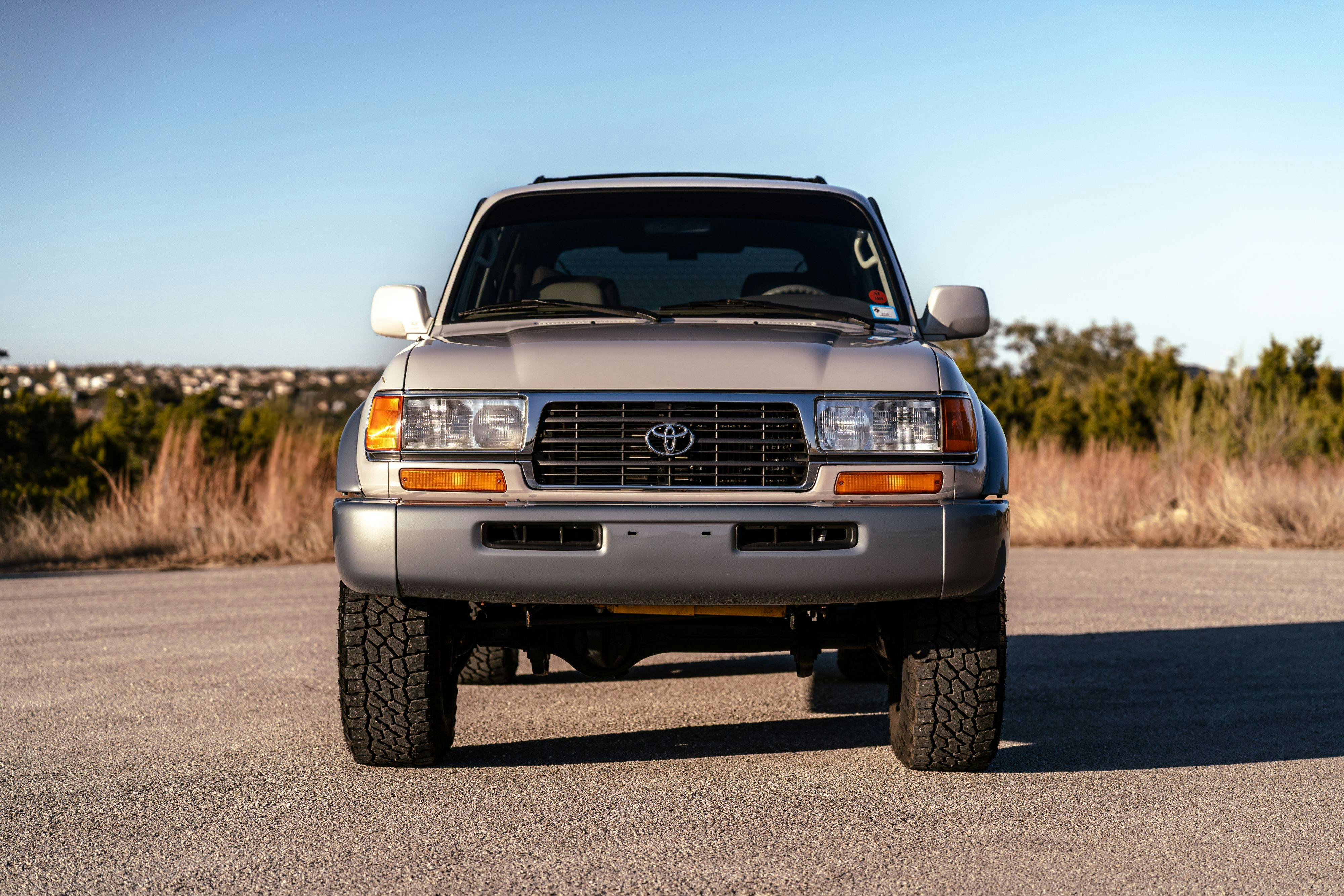 1997 Toyota Land Cruiser FJZ80 in Desert Dune Metallic with Moonglow Pearl cladding.