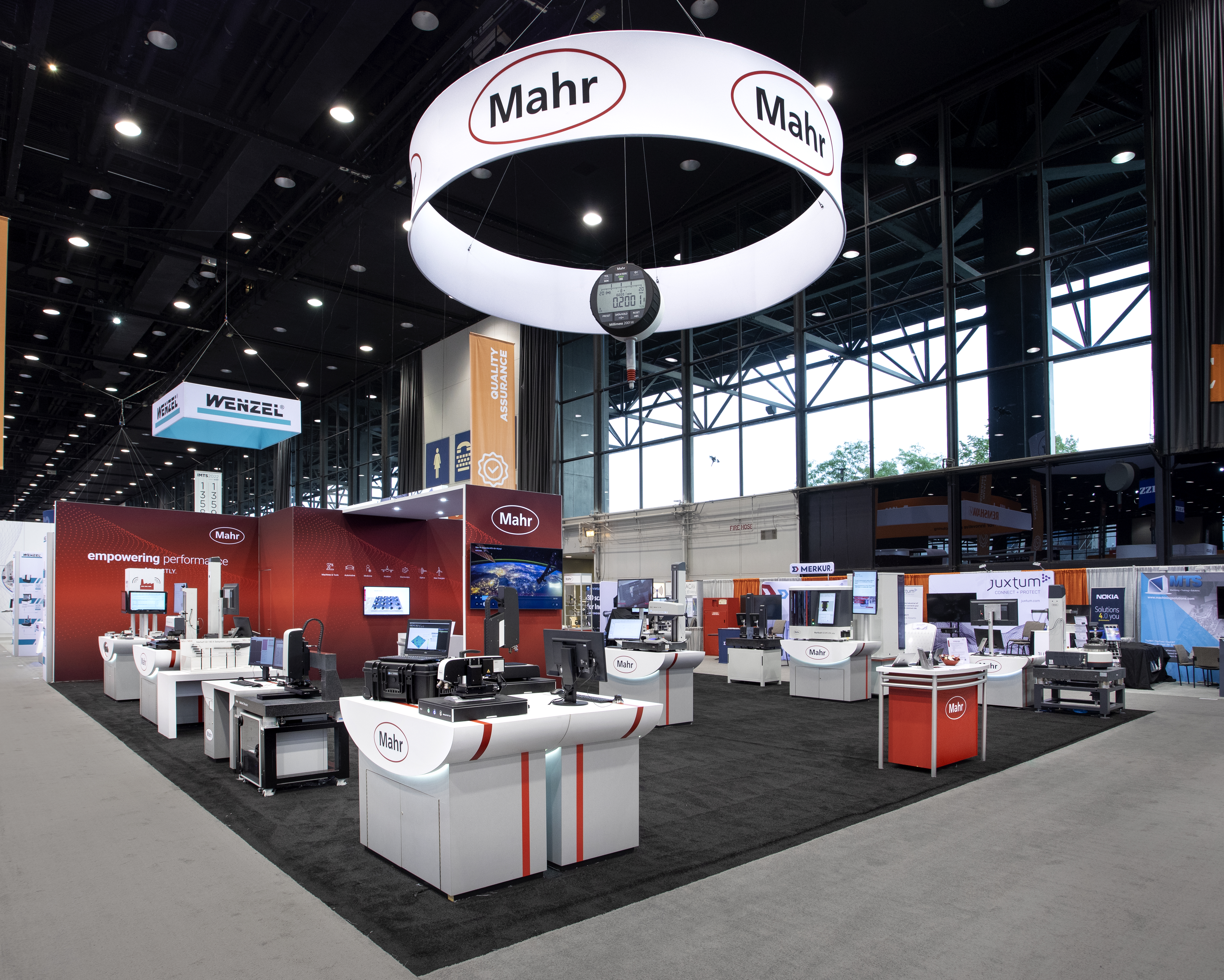A Mahr showcase at the International Manufacturing Technology Show in 2022 full of bright technological displays.