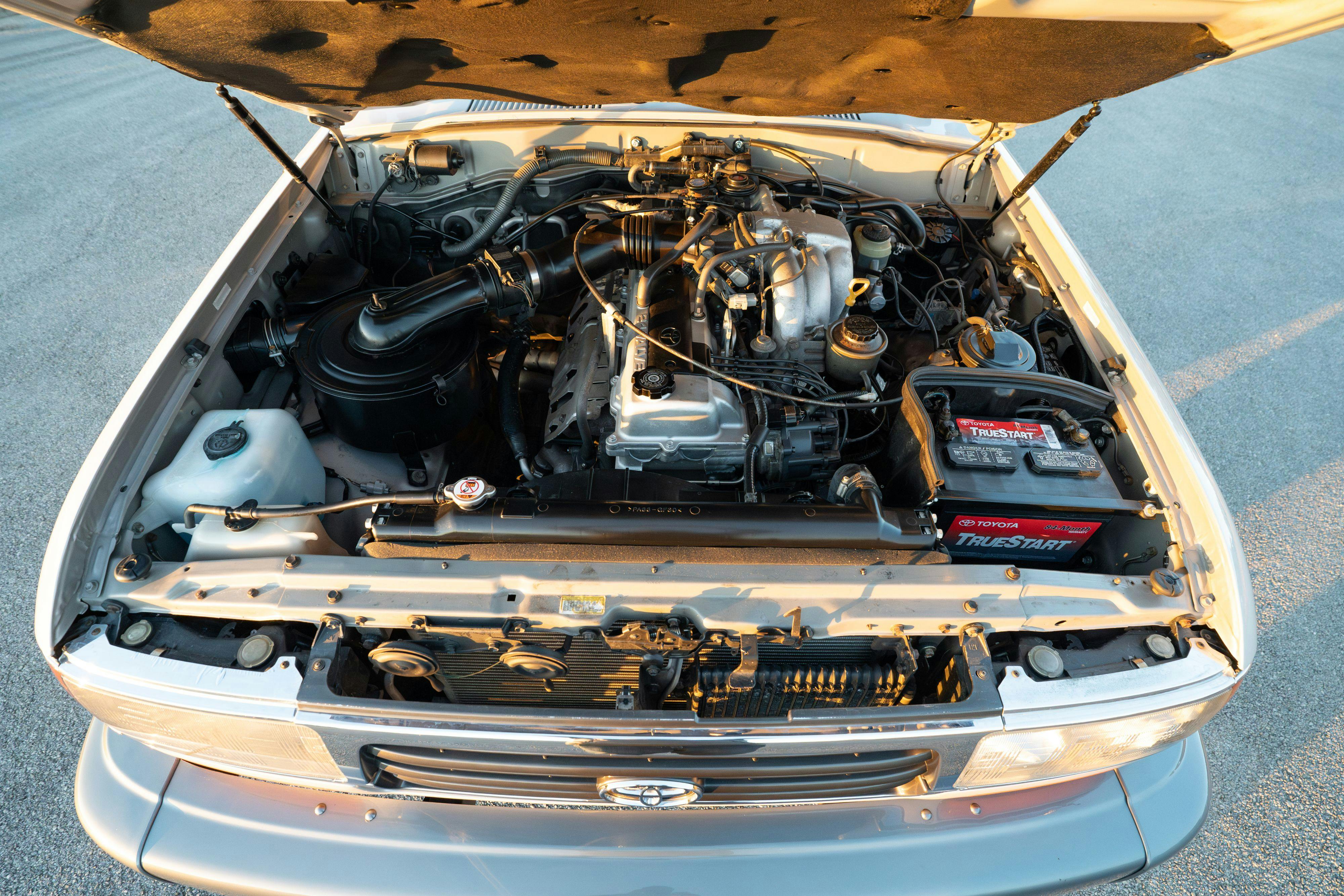 1997 Toyota Land Cruiser FJZ80 engine in Desert Dune Metallic with Moonglow Pearl cladding.