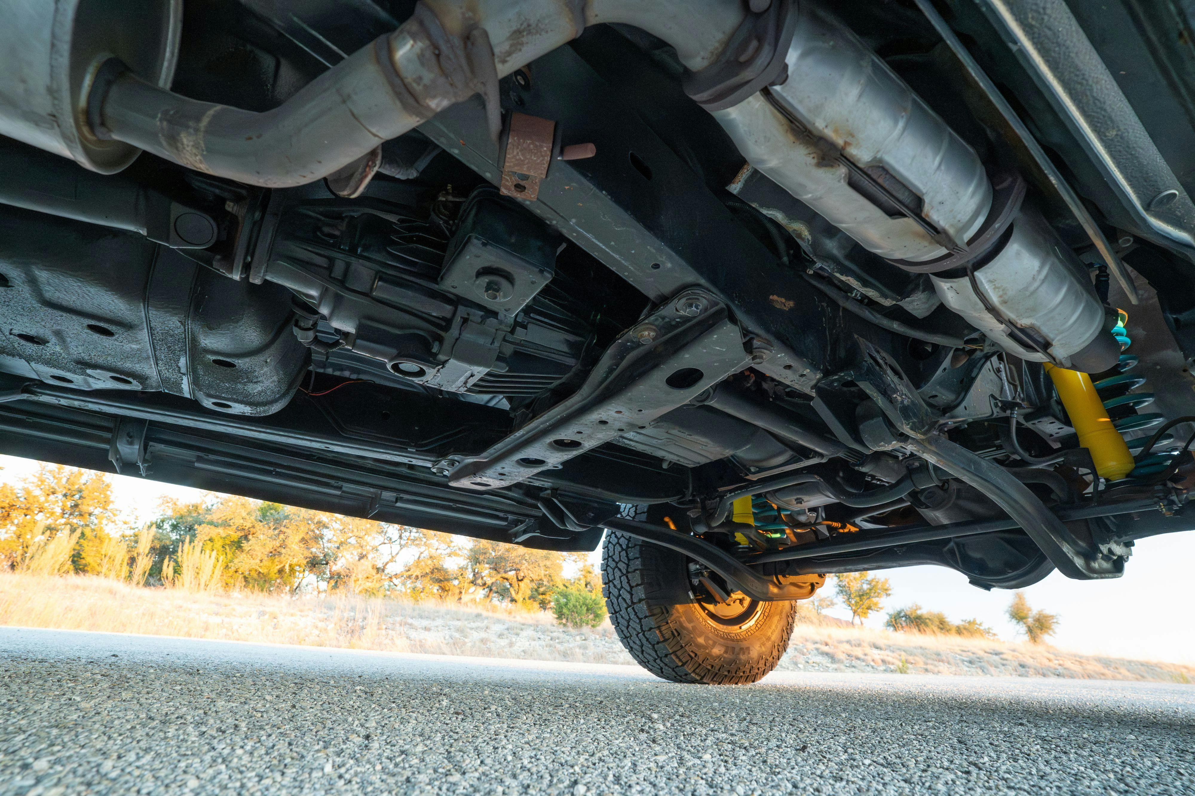 1997 Toyota Land Cruiser FJZ80 underbody in Desert Dune Metallic with Moonglow Pearl cladding.